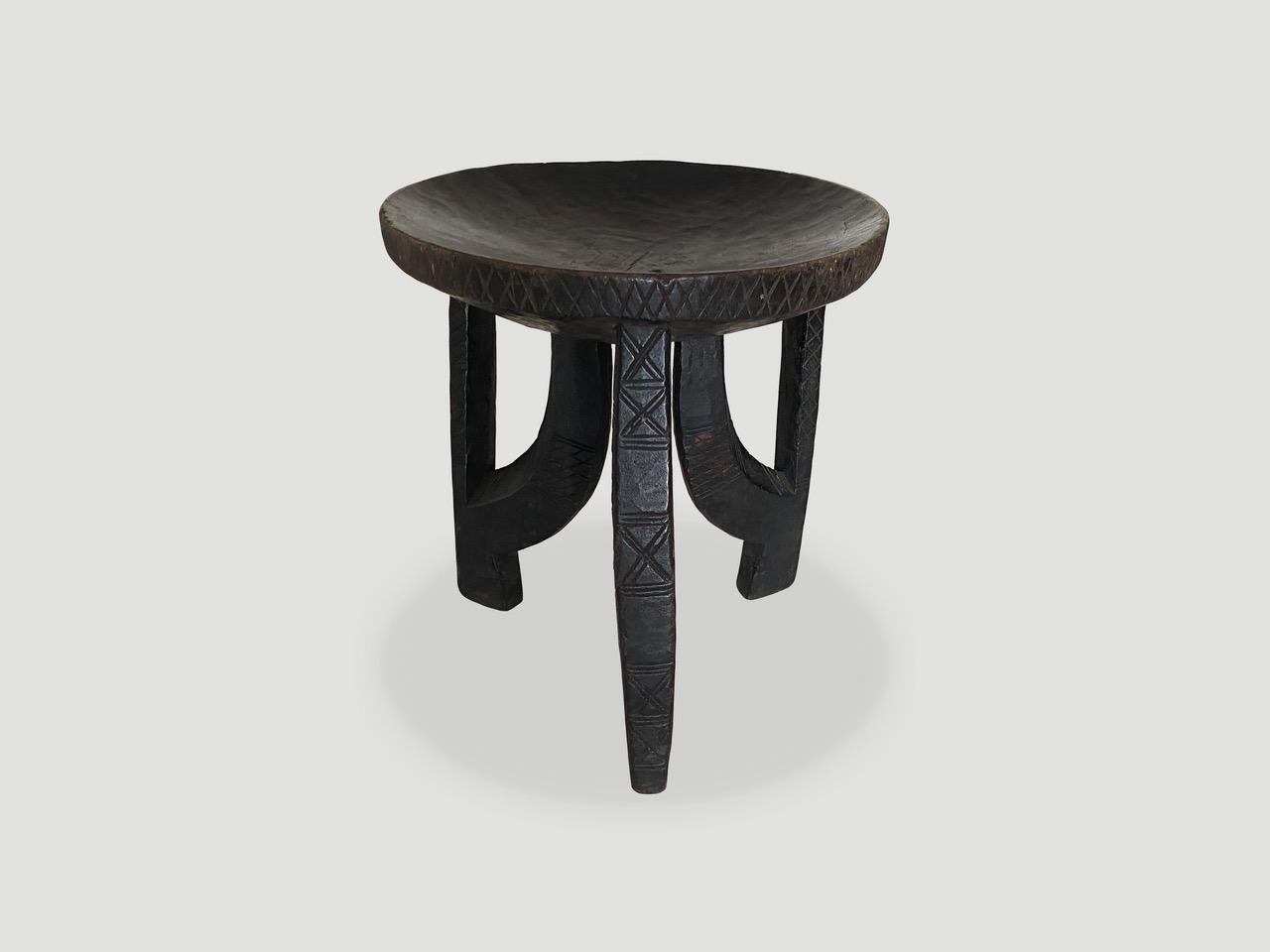 Impressive antique African side table, stool or bowl hand carved from a single piece of wood. Great for placing a book or perhaps towels in a bathroom, magazines etc. A beautiful, versatile item that is both sculptural and usable. This one is so