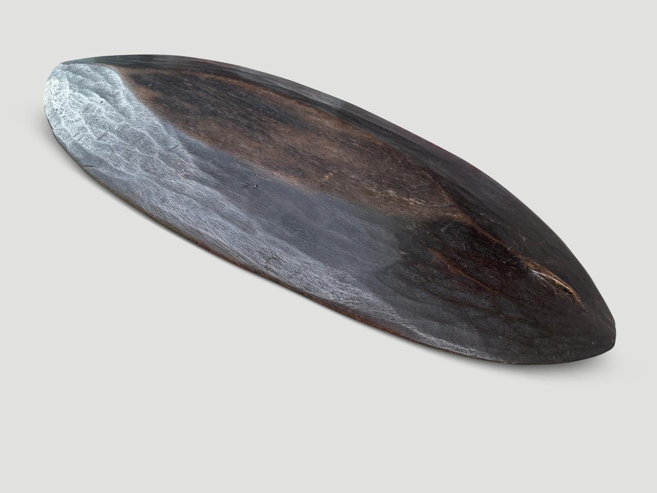 Beautiful rare antique shallow tray from the Mentawai islands. Hand carved from a single piece of wood with lovely patina. Circa 1900. 

This antique tray was sourced in the spirit of Wabi-Sabi, a Japanese philosophy that beauty can be found in