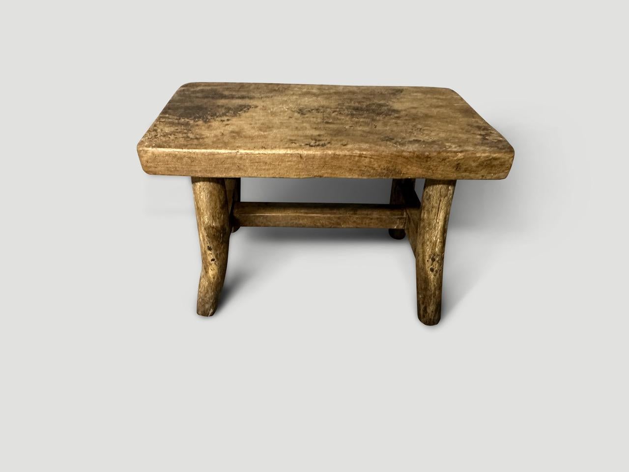 Antique hand made side table or small bench with a single thick top. Lovely patina and character on this beautiful piece. Circa 1950

This side table or bench was hand made in the spirit of Wabi-Sabi, a Japanese philosophy that beauty can be found