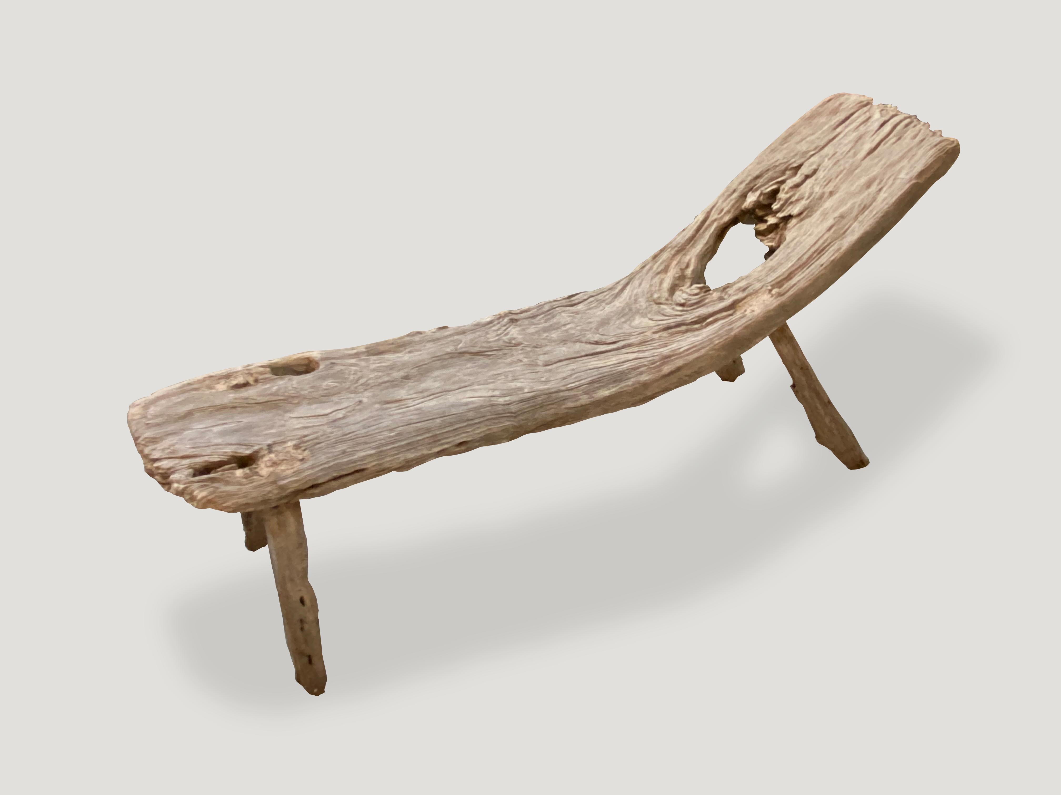 Beautiful antique bench with stunning erosion on the ends. A single thick slab with a natural incline. Fabulous in a modern residence as an art object and also usable.

This bench or chaise was sourced in the spirit of wabi-sabi, a Japanese