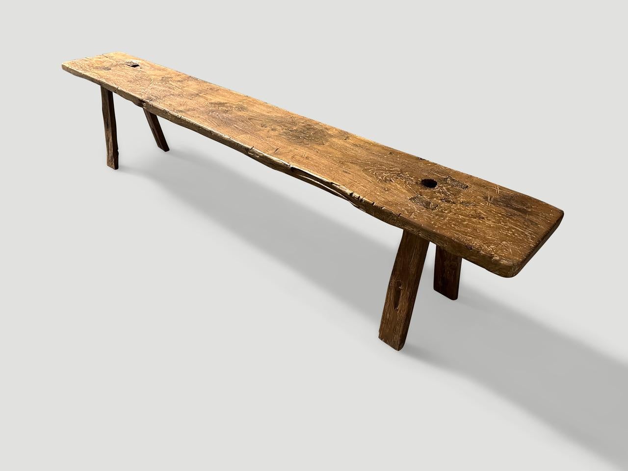Antique bench hand made from a thick single panel of teak wood with lovely patina. Circa 1950.

This bench was hand made in the spirit of Wabi-Sabi, a Japanese philosophy that beauty can be found in imperfection and impermanence. It is a beauty of