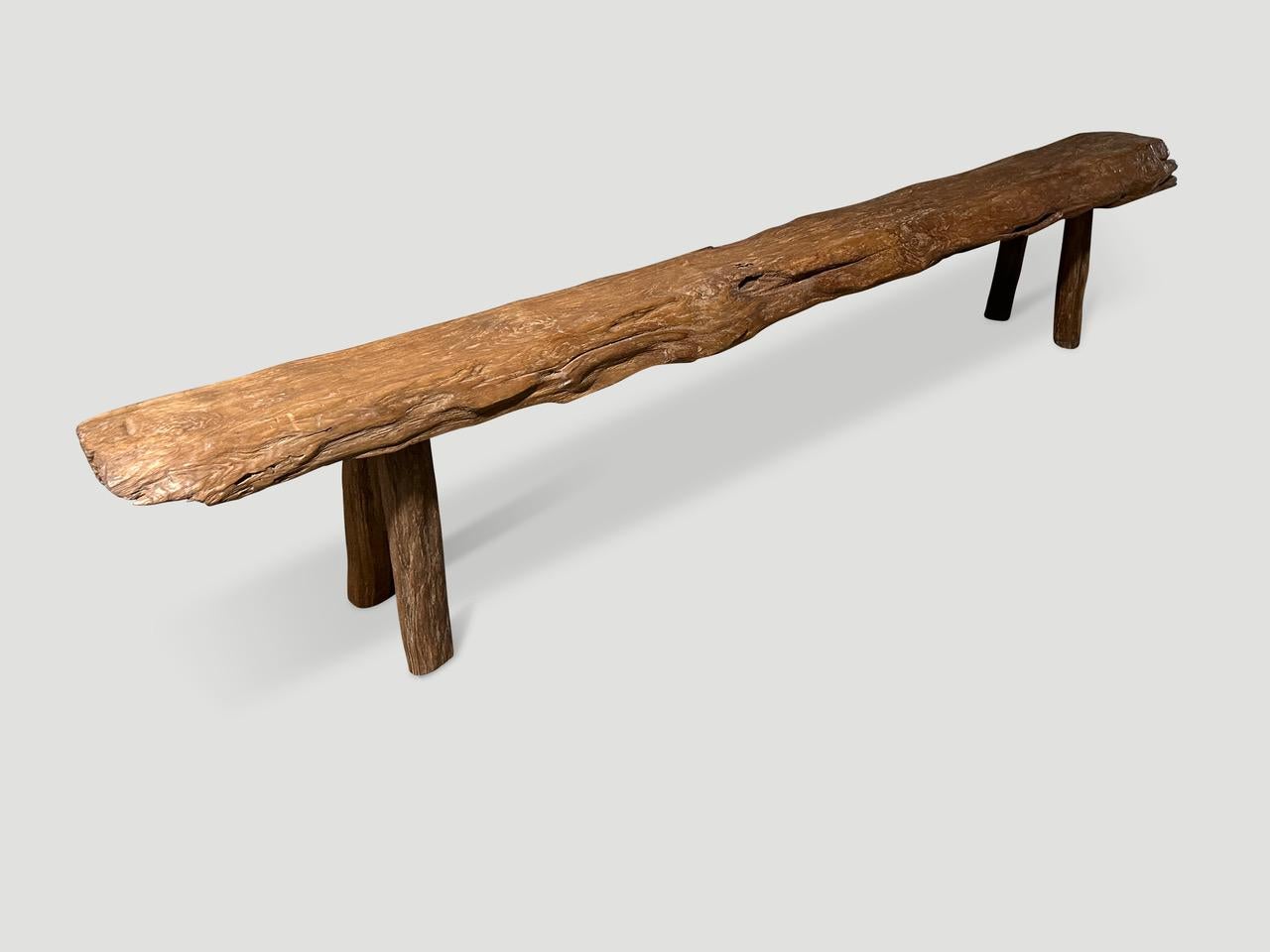 Antique bench hand made from a single thick teak log with beautiful patina and character within the wood. Circa 1950.

This bench was hand made in the spirit of Wabi-Sabi, a Japanese philosophy that beauty can be found in imperfection and