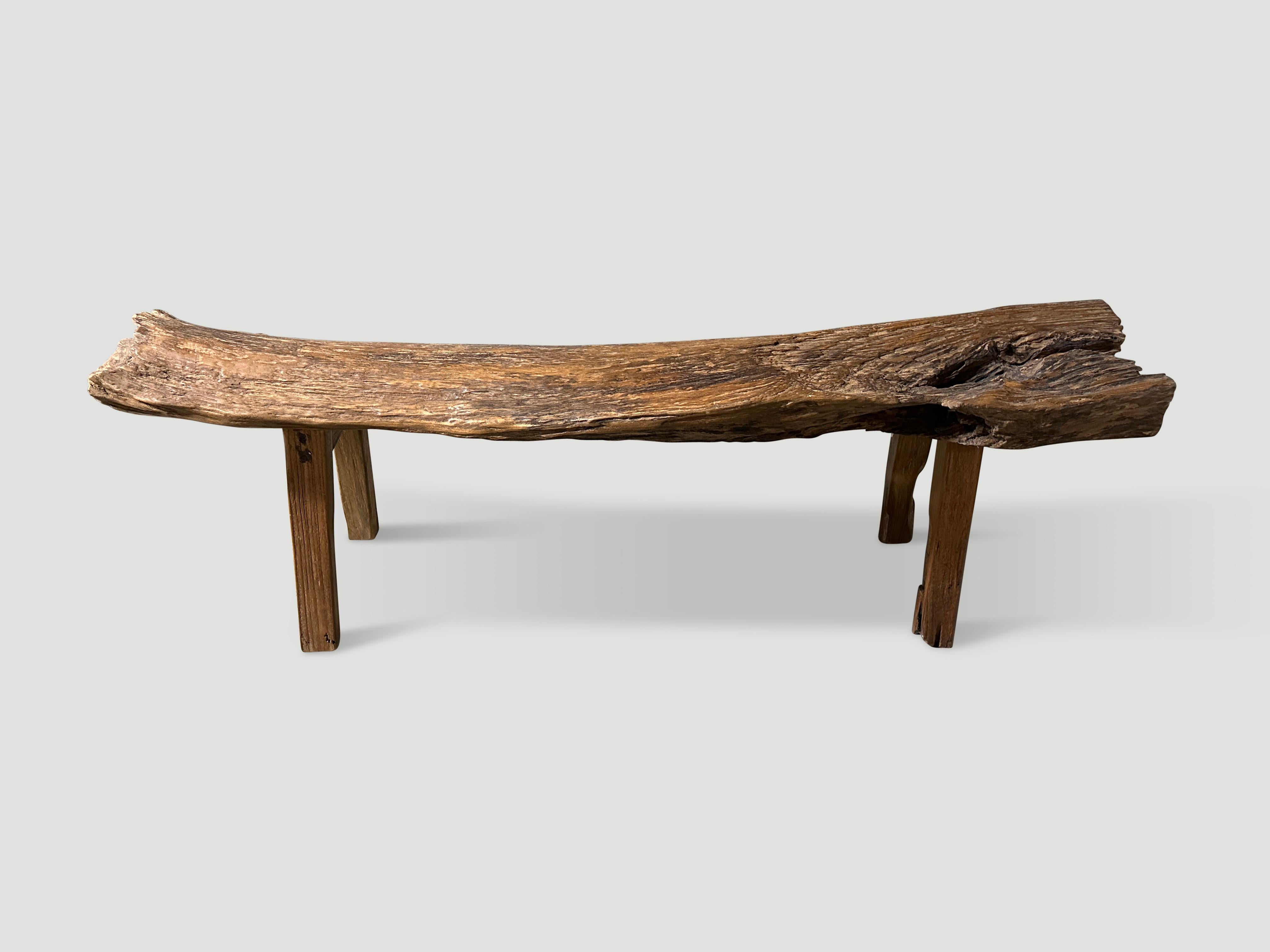 Antique bench with beautiful character hand made from a single thick teak log with lovely patina. Circa 1950.

This bench was hand made in the spirit of Wabi-Sabi, a Japanese philosophy that beauty can be found in imperfection and impermanence. It