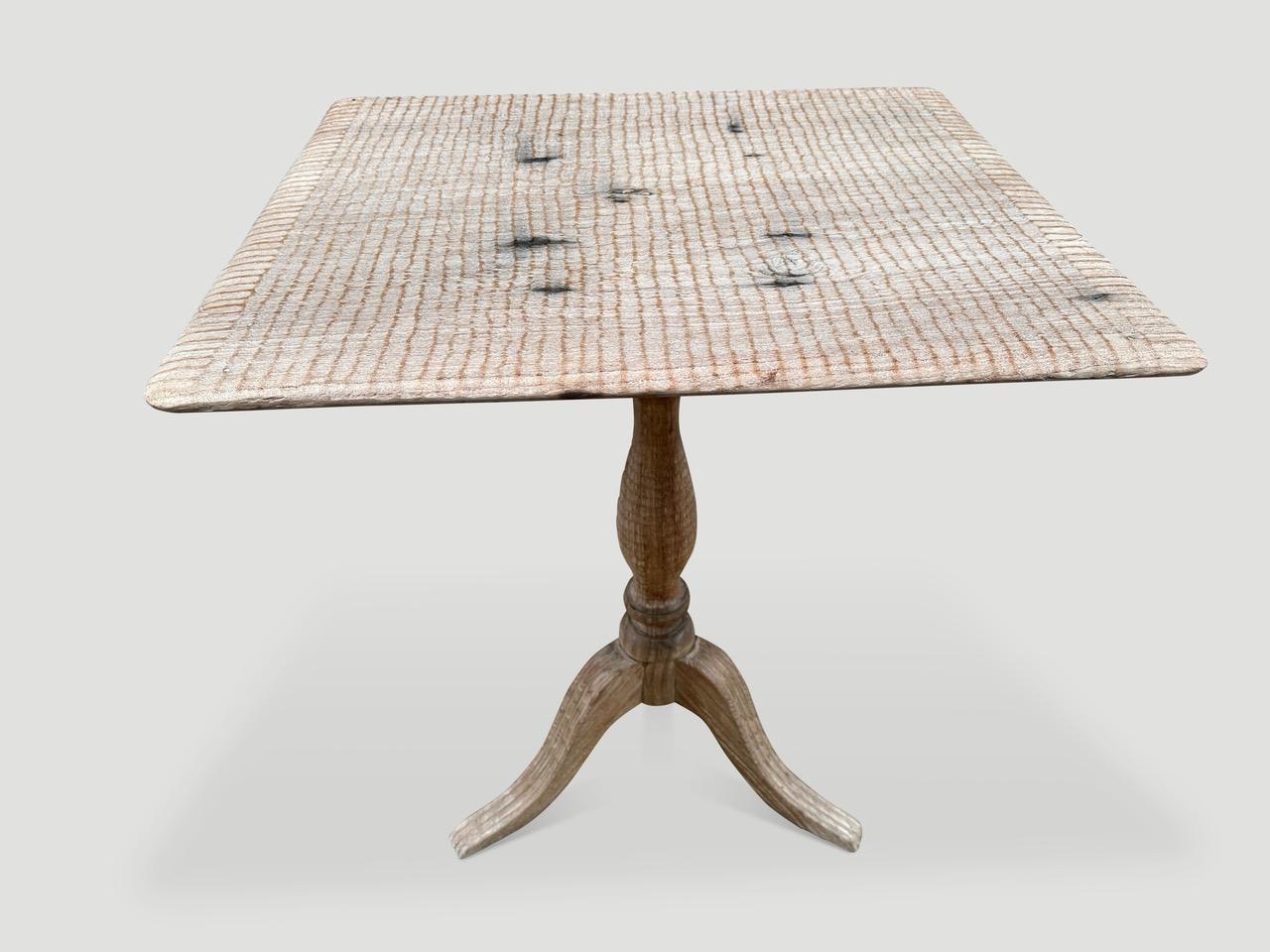 Impressive hand carved legs on this antique side table or entry table. The top is made from a single piece of teak wood and we have added our unique minimalist carving. Finished in a translucent milky tone revealing the beautiful wood grain. It’s
