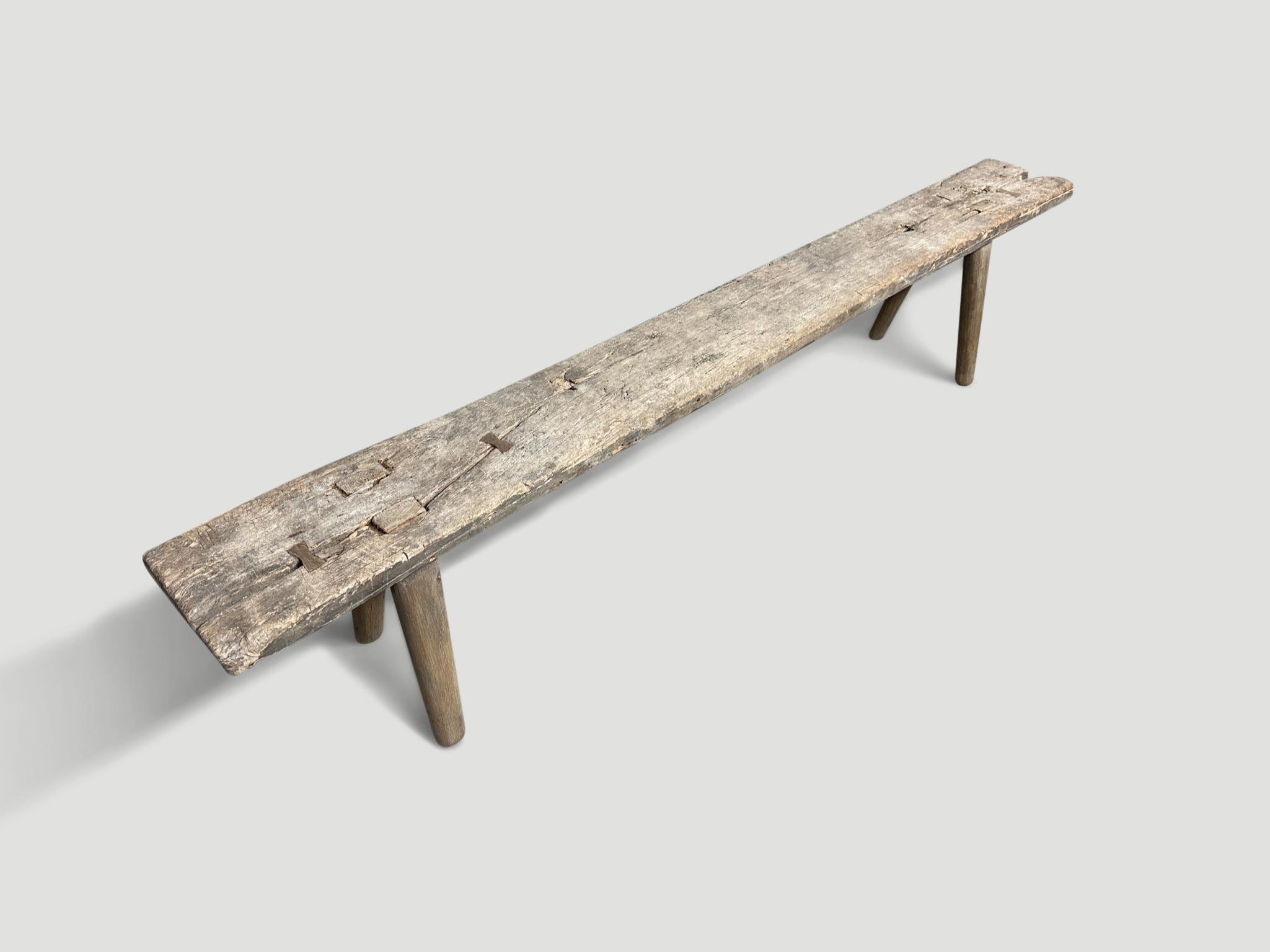 Antique Wabi Sabi bench. A single aged teak panel celebrating the cracks and crevices and all the other marks that time and loving use have left behind. We added smooth teak minimalist legs and butterflies inlaid into the top. It’s all in the