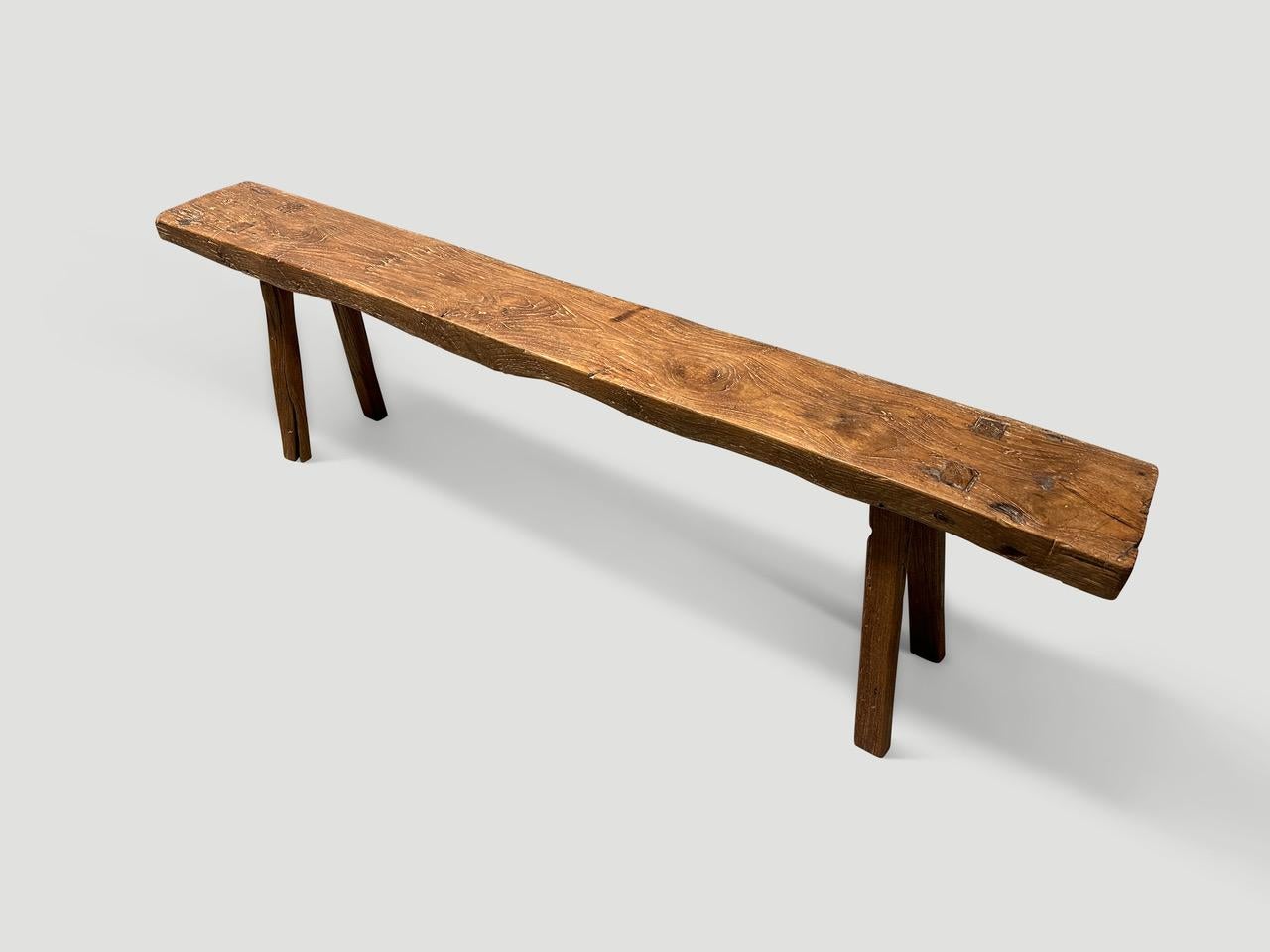 Impressive antique bench with beautiful character and patina. Hand made from a single two inch thick teak top. Circa 1950.

This bench was hand made in the spirit of Wabi-Sabi, a Japanese philosophy that beauty can be found in imperfection and