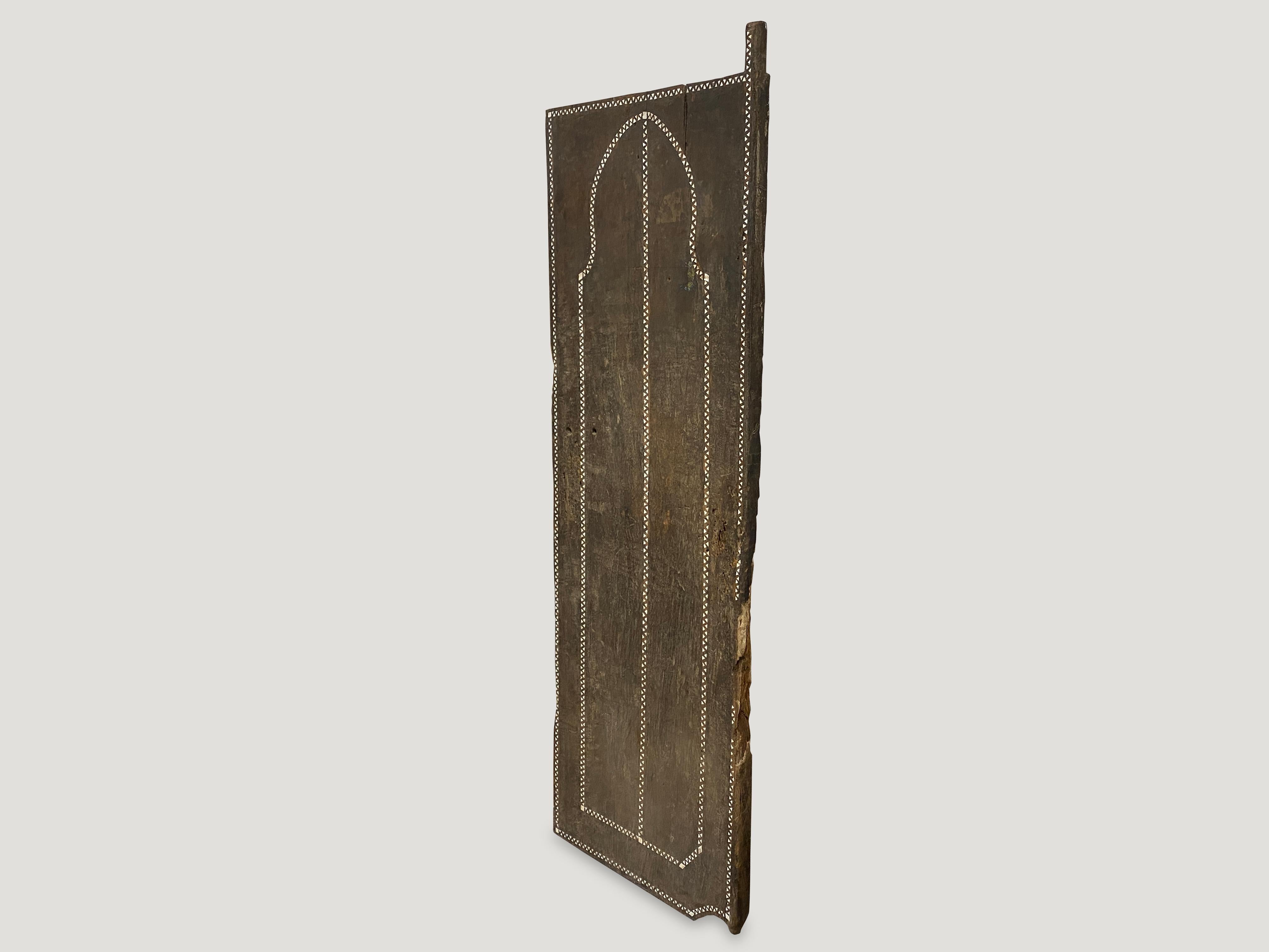 Antique temple door made from a single width of wood. We added the shell inlay by hand. Great as a headboard, coffee table or simply as a piece of art. We currently have a large collection of temple doors available. All unique with added shell