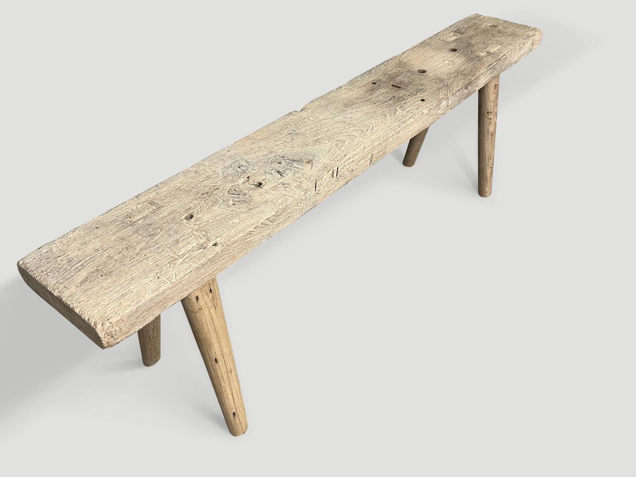A single two inch thick antique panel with lovely character within the wood. We added smooth teak minimalist legs to produce this beautiful bench and finished with a secret ingredient, revealing the unique wood grain. It’s all in the details.

This
