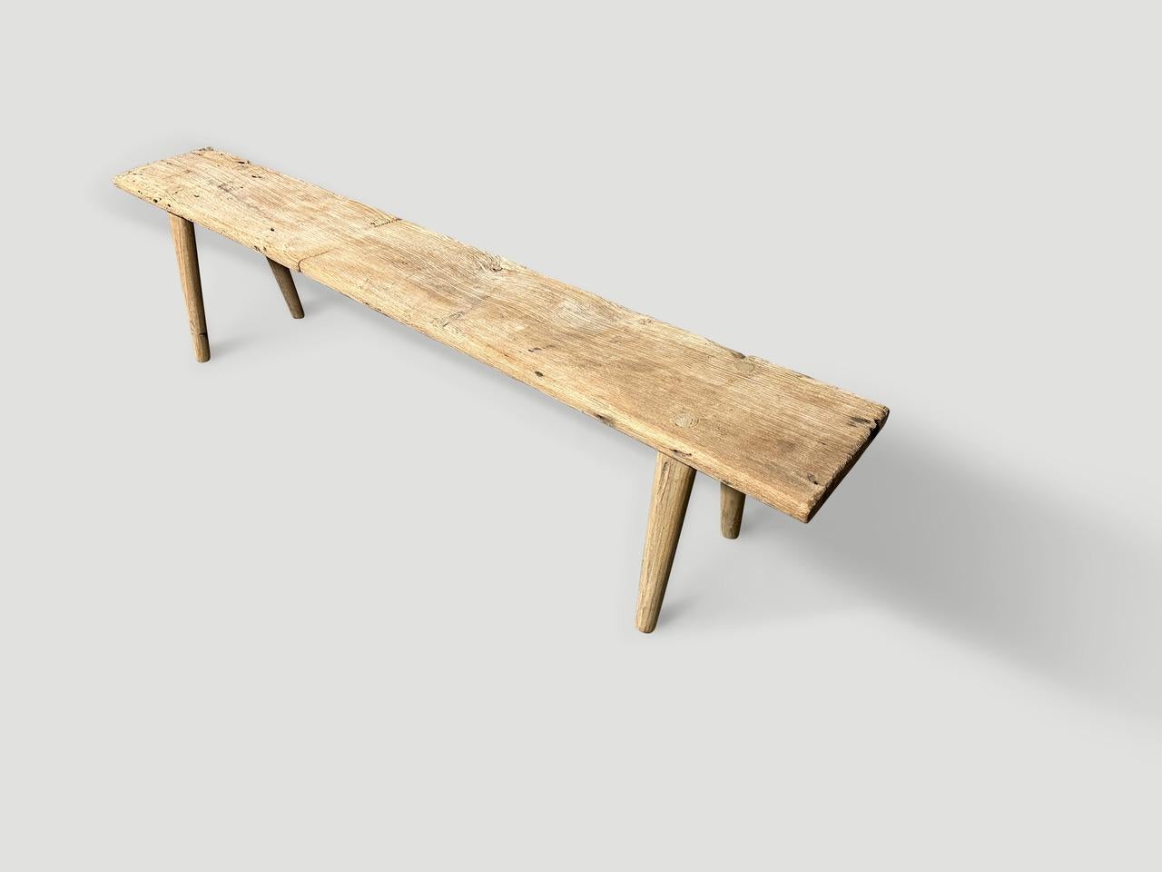 A single thick antique panel with lovely character within the wood. We added smooth teak minimalist legs to produce this beautiful bench and finished with a secret ingredient, revealing the unique wood grain. It’s all in the details.

This bench was