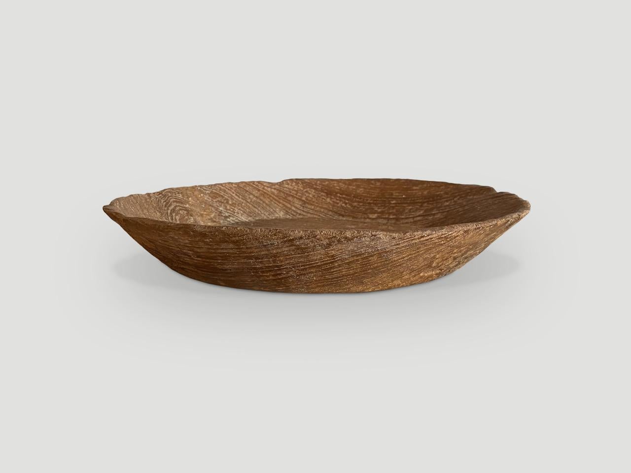 Beautiful bowl hand carved out of a single piece of teak wood. Both sculptural and usable.

This bowl was handmade in the spirit of Wabi-Sabi, a Japanese philosophy that beauty can be found in imperfection and impermanence. It is a beauty of