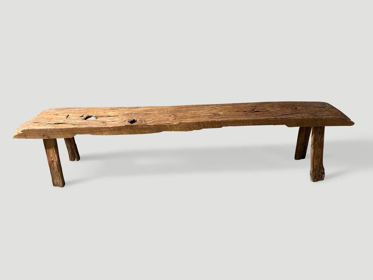 Impressive antique bench with beautiful character and patina hand made from a single three inch thick teak log. Circa 1950.

This bench was hand made in the spirit of Wabi-Sabi, a Japanese philosophy that beauty can be found in imperfection and