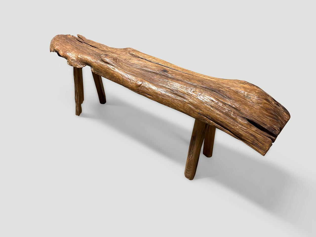 Impressive antique bench with beautiful character and patina. Hand made from a single thick teak log. Circa 1950.

This bench was hand made in the spirit of Wabi-Sabi, a Japanese philosophy that beauty can be found in imperfection and impermanence.