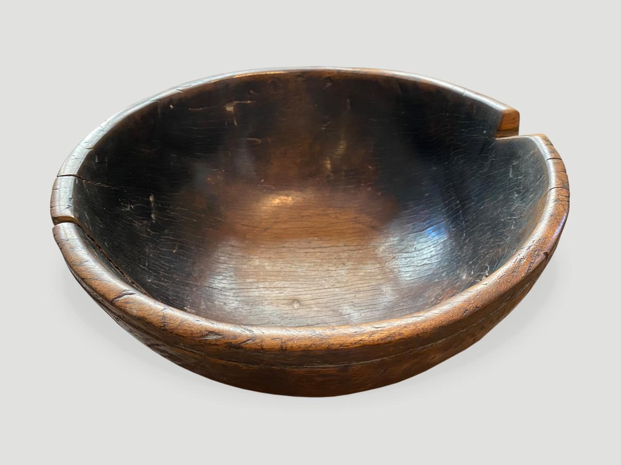 Beautiful antique bowl carved from a single piece of hardwood with stunning patina, mid 20th century

This bowl was sourced in the spirit of wabi-sabi, a Japanese philosophy that beauty can be found in imperfection and impermanence. It is a beauty