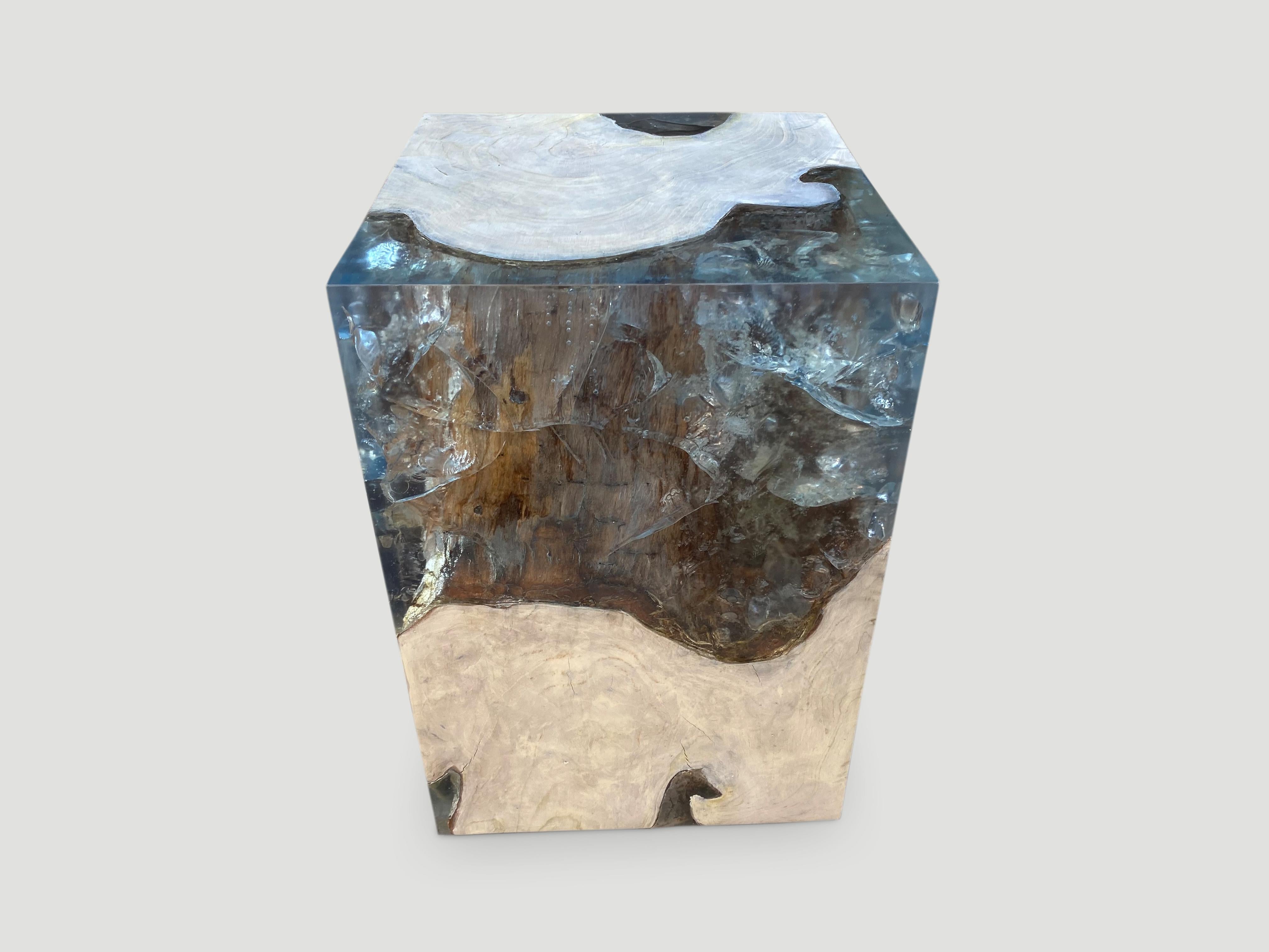 The St. Barts side table is a unique variation of the teak and cracked resin cube. Ice blue, aqua resin or new to 2022 deep sea blue resin, is cracked and added into the natural grooves of the bleached teak wood and finally sanded and finished with