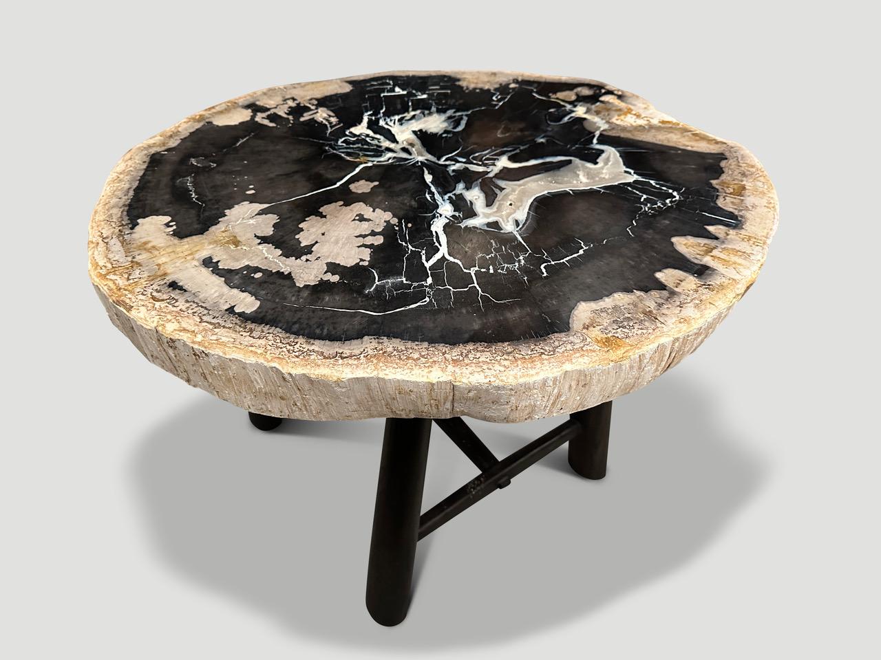 Impressive two and a half inch slab top with the most beautiful contrasting color tones and featuring natural crystals. Resting on a custom espresso teak wood mid century style base. It’s fascinating how Mother Nature produces these stunning 40