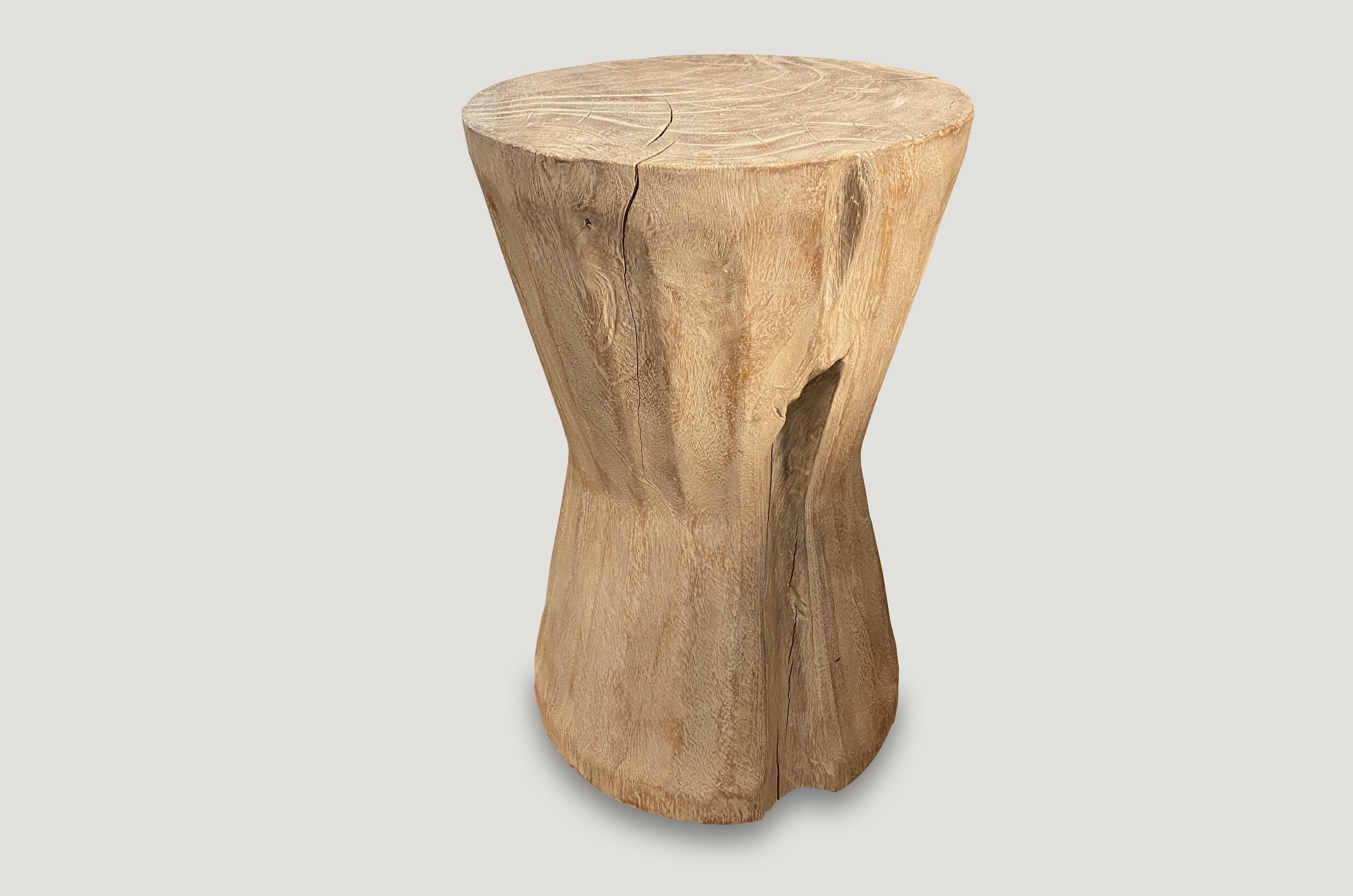 Hand carved bevelled side table or stool that celebrates cracks and crevices found in reclaimed teak wood. Please scroll down to the last image which we produced for 1Hotel Miami Beach. Perfect for inside or outside living.

Andrianna Shamaris.