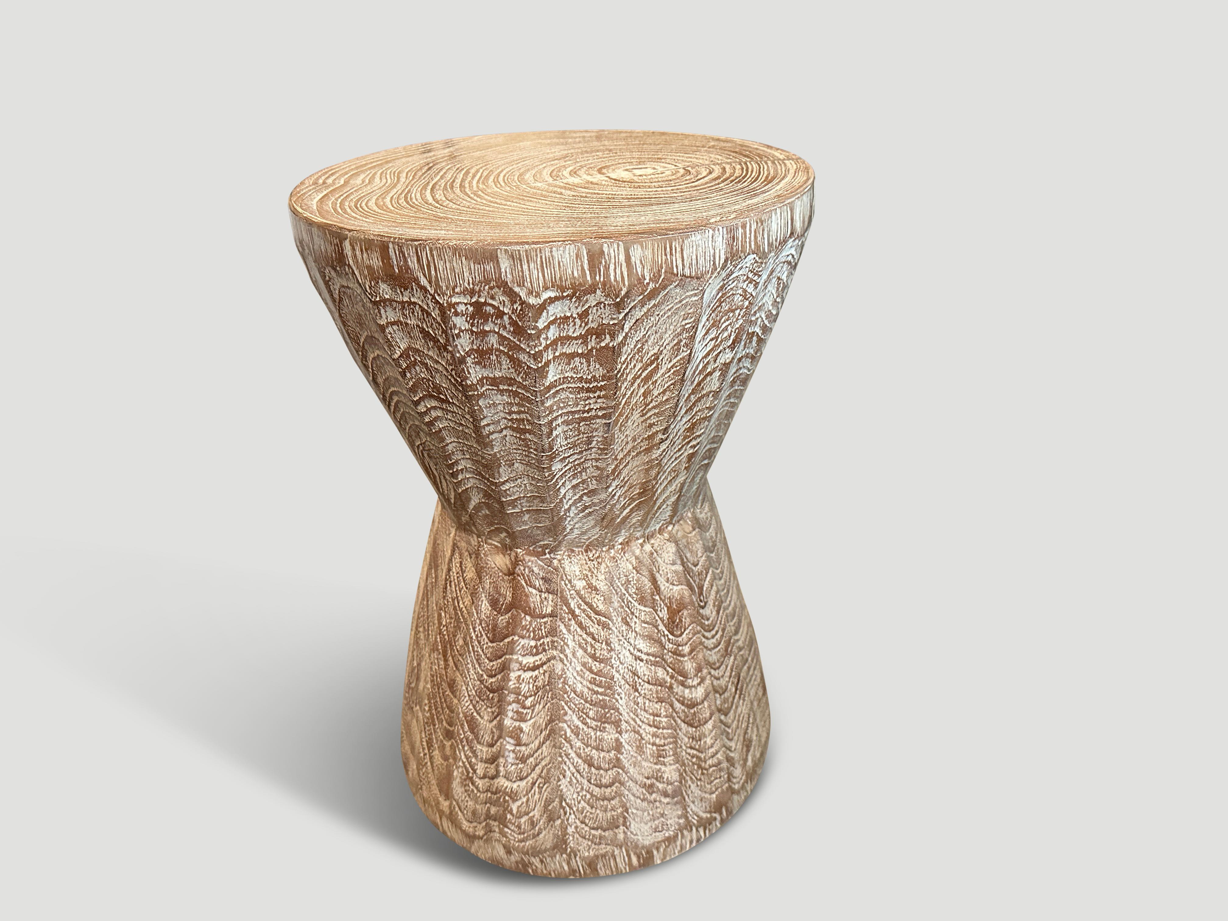 Hand carved bevelled teak side table or stool. Celebrating the cracks and crevices found in reclaimed teak wood. We added a ceruse finish revealing the beautiful wood grain. The final image produced for 1Hotel Miami Beach. Custom stains available.