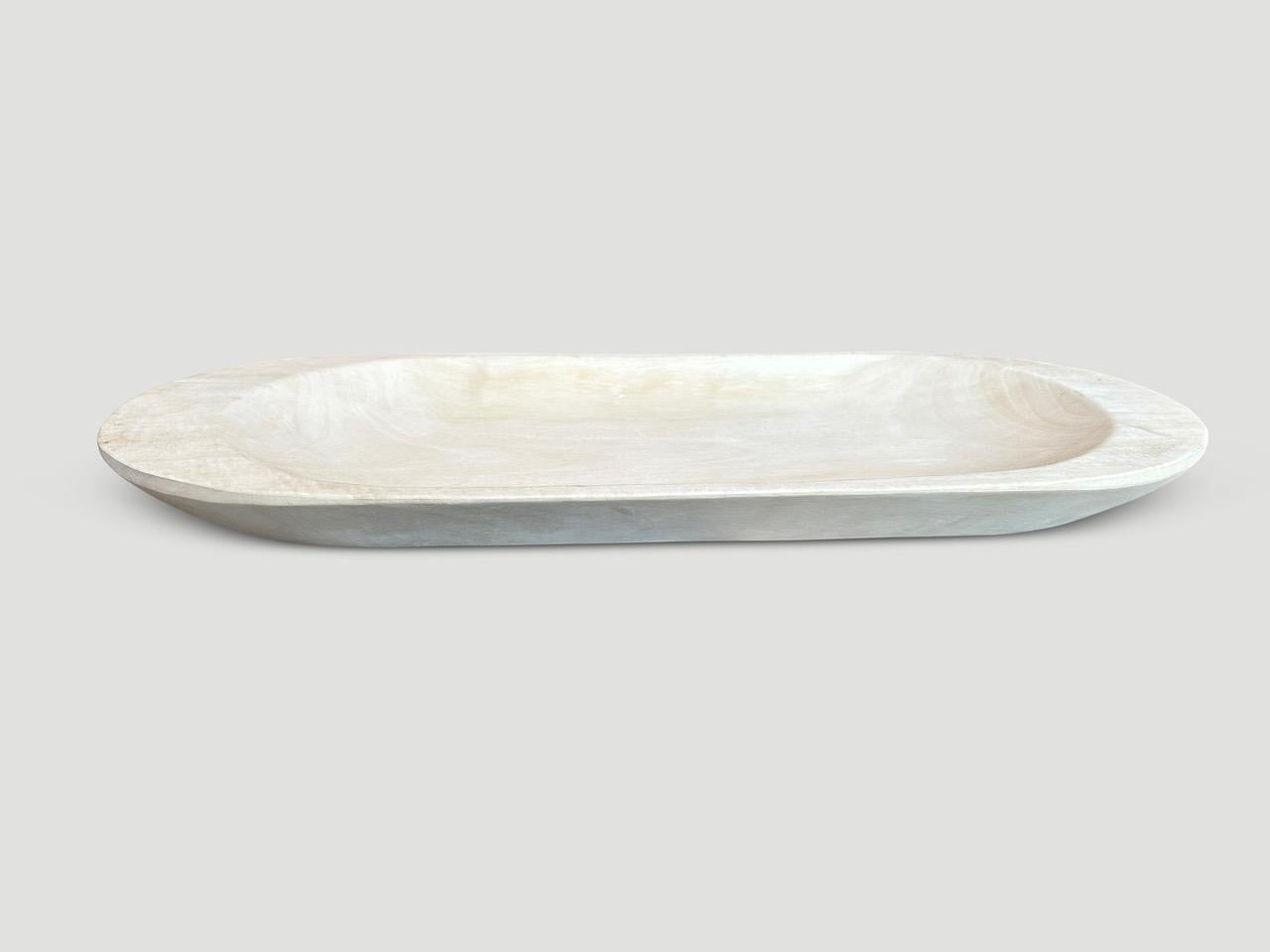 Hand carved long shallow bowl. Reclaimed suar wood is bleached revealing the beautiful wood grain.

The St. Barts Collection features an exciting line of organic white wash, bleached and natural weathered teak furniture. The reclaimed teak is