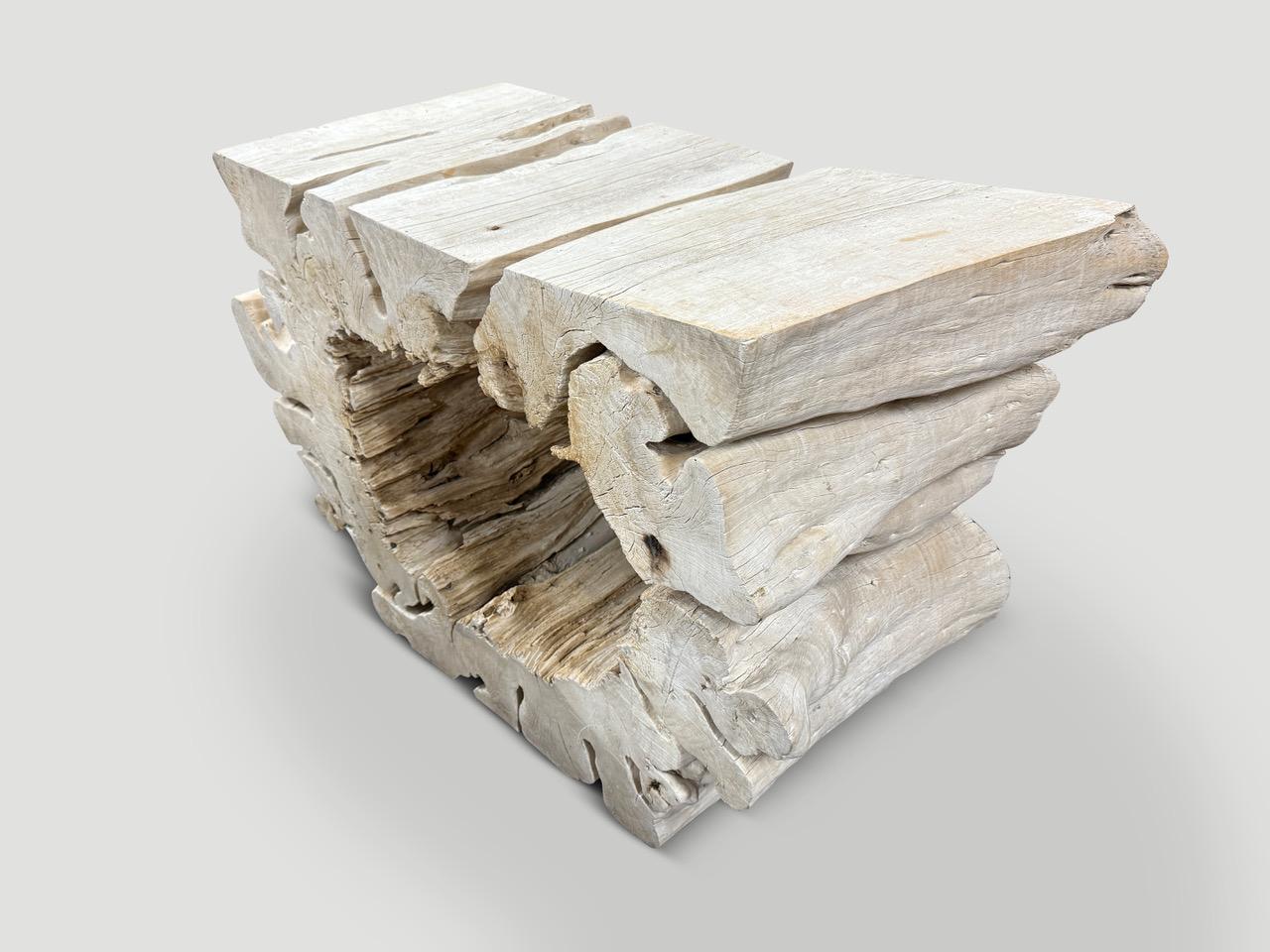 A sculptural bleached tamarind wood console table. We stabilized the wood and cleaned out the center and finally bleached this natural organic piece revealing the beautiful wood grain. Full dimensions; 39” wide on one side x 35” wide on opposite