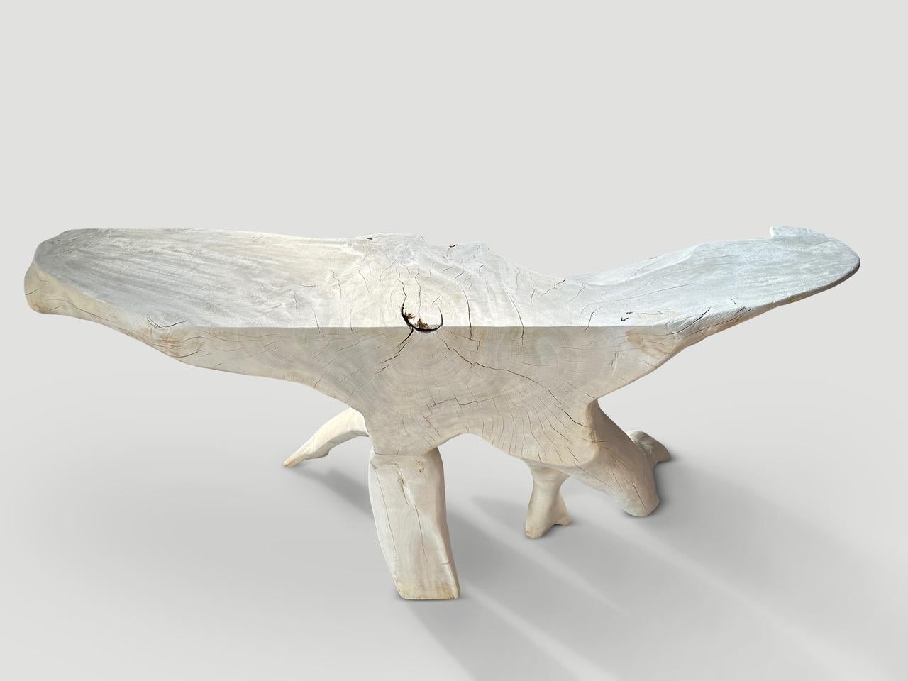 Impressive natural organic formed console table made from a hundred year old reclaimed mahogany root. Fabulous on both sides. Glass or lucite can be added, if preferred on the top section. Bleached and finished with a light white wash revealing the