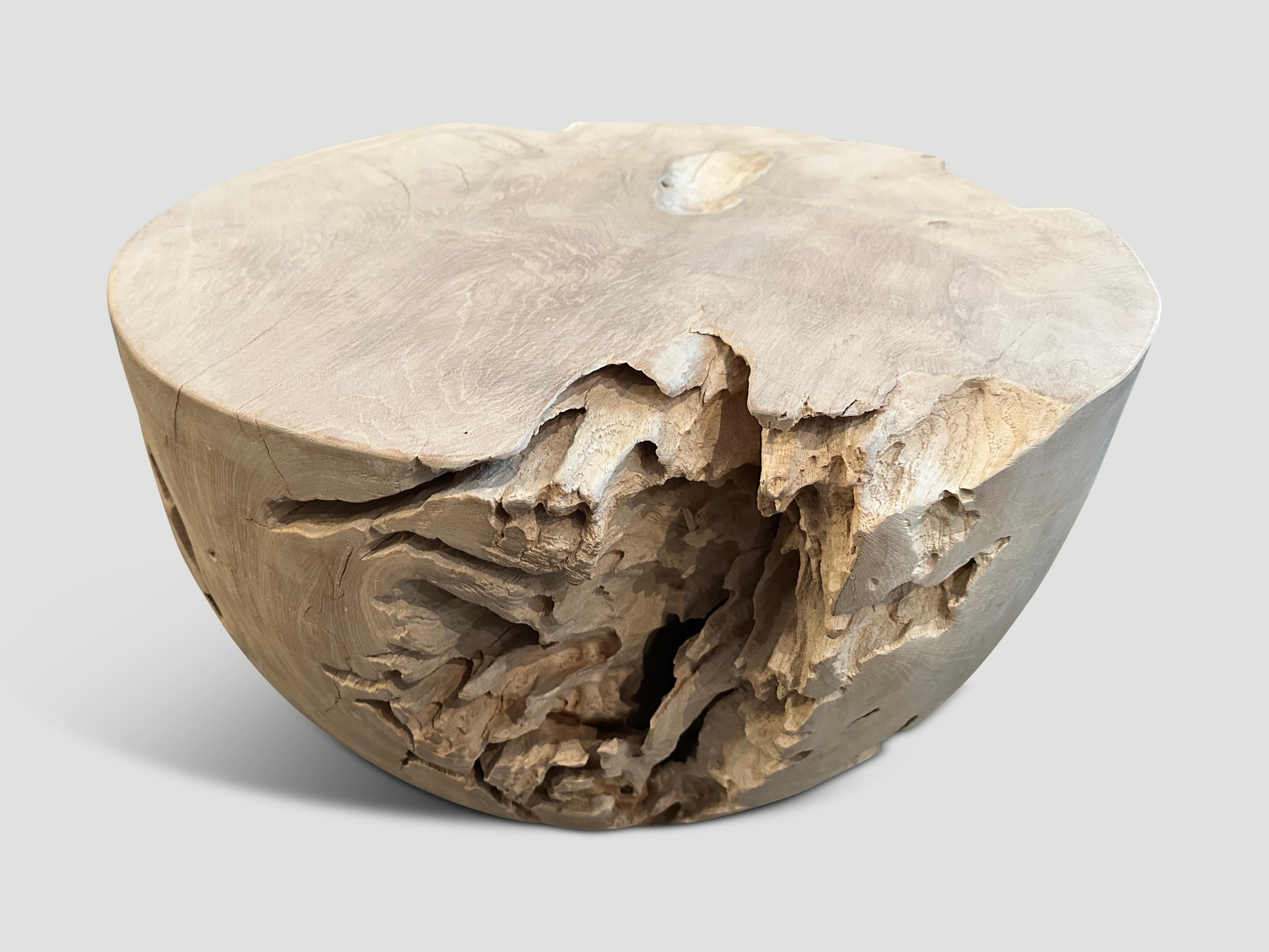 Reclaimed teak root coffee table hand carved into a drum shape whilst respecting the natural organic wood. We added a light white wash revealing the beautiful wood grain. Both usable and sculptural.

The St. Barts Collection features an exciting