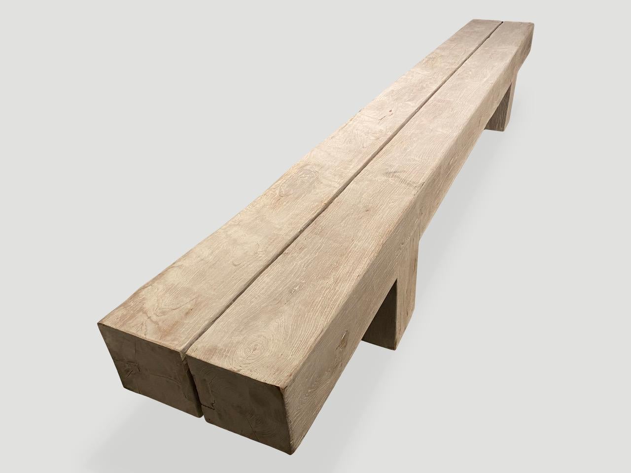 Impressive reclaimed bleached teak wood log bench. The two top pieces rest on a modern teak base. Custom sizes available. 

The St. Barts Collection features an exciting line of organic white wash, bleached and natural weathered teak furniture. The