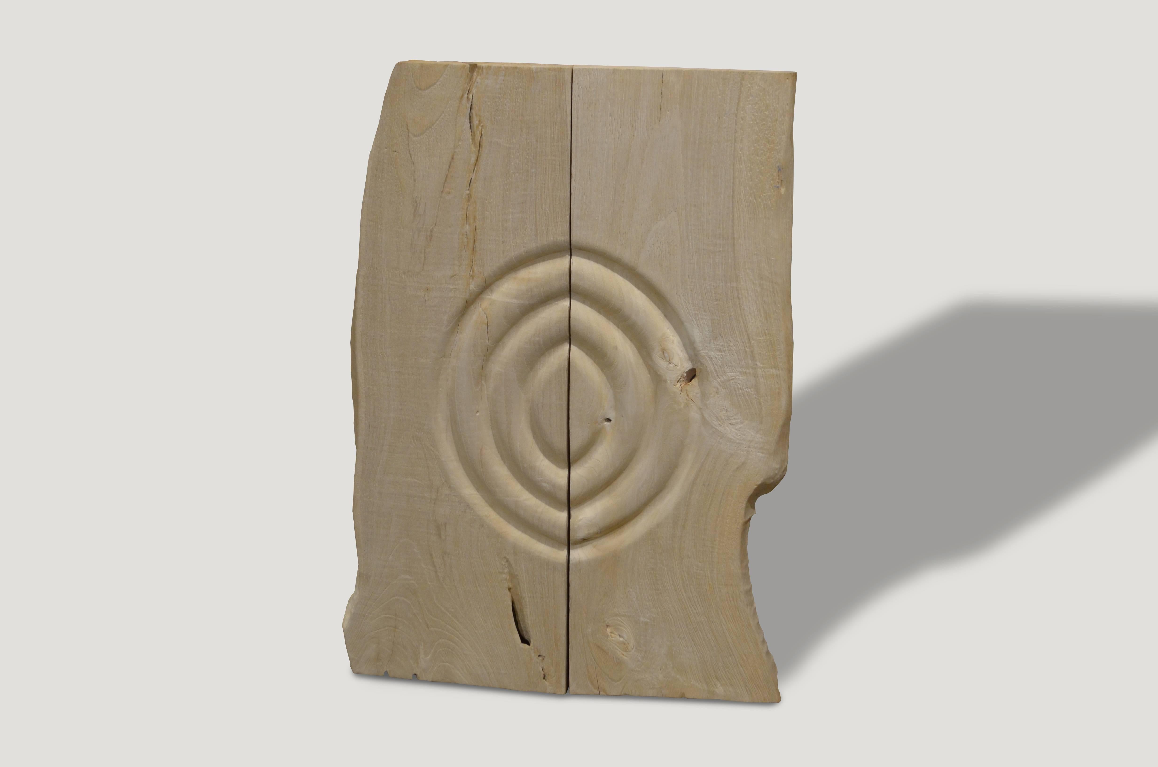 Bleached reclaimed teak wood panel. Hand carved minimalist circle with a natural live edge. Beautiful hanging on a wall vertical or horizontal, together or with a space between. Organic is the new modern.

The St. Barts collection features an