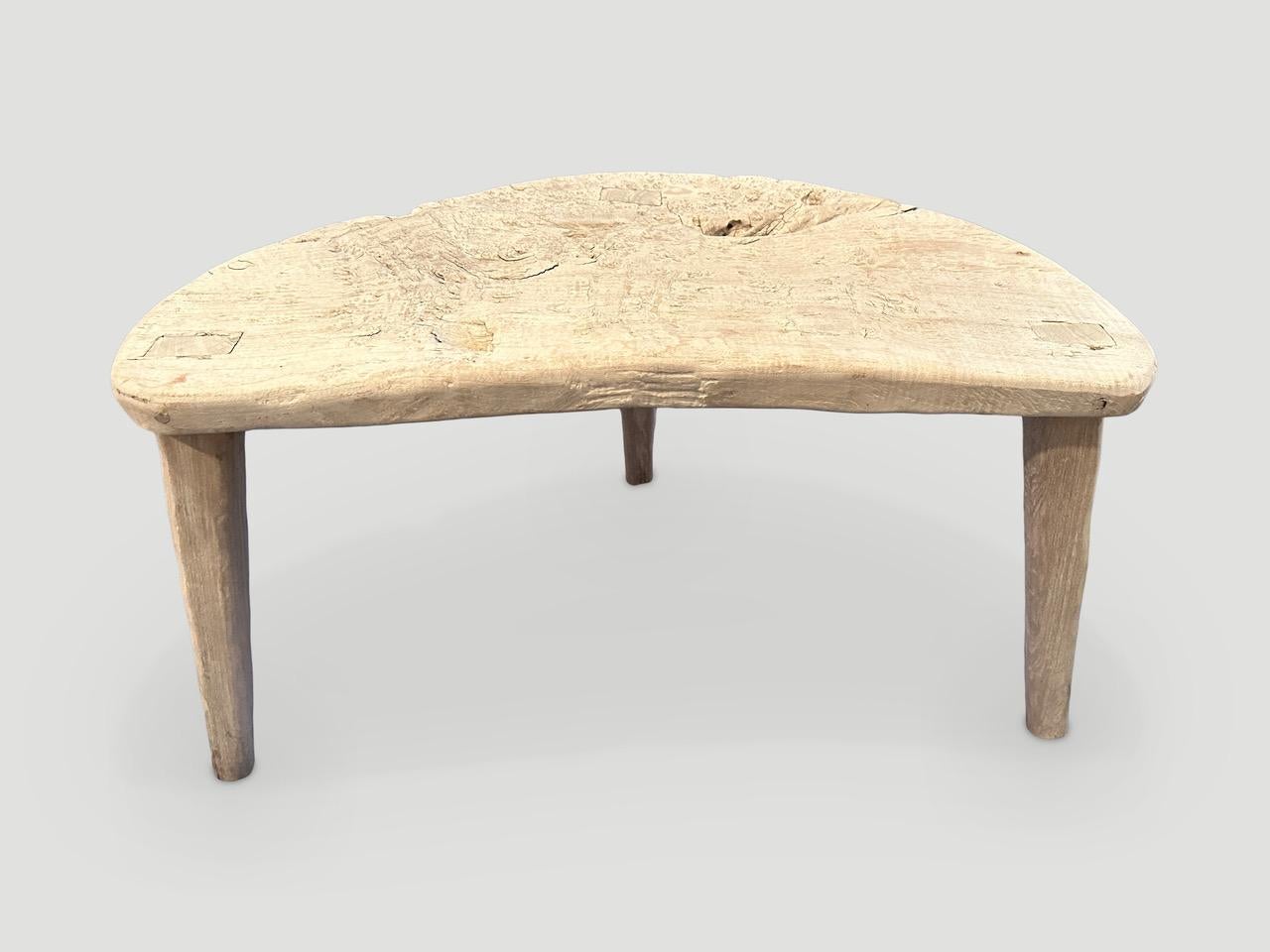 Reclaimed bleached wood side table. We added minimalist legs to this organic aged slab top. Both usable and sculptural.

The St. Barts Collection features an exciting line of organic white wash, bleached and natural weathered teak furniture. The
