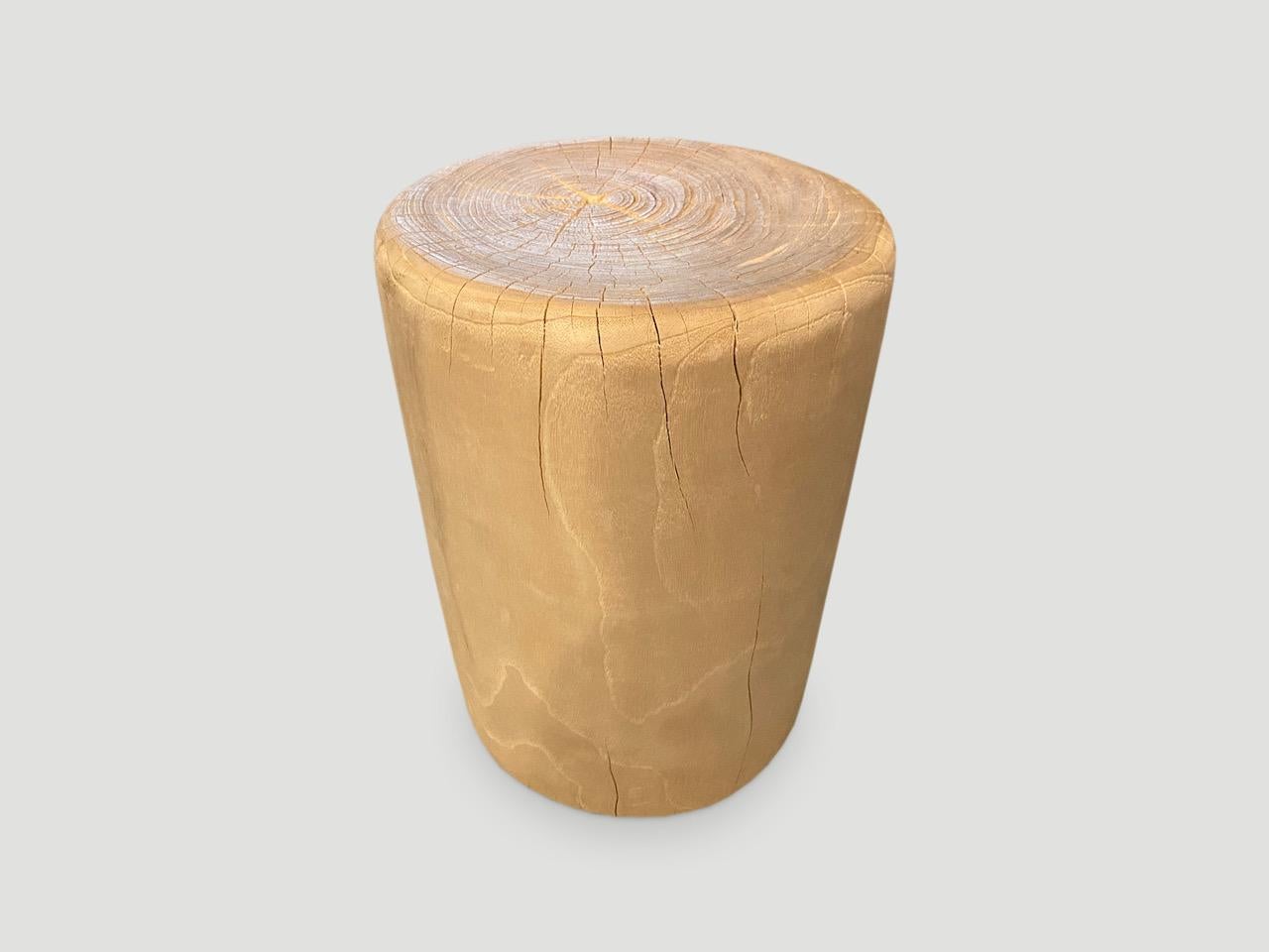 Reclaimed teak wood side table or stool. Hand carved with soft rounded sides, into a drum shape whilst respecting the natural organic wood. Bleached to a bone finish. There is a slight graduation from the bottom to the top. Also available