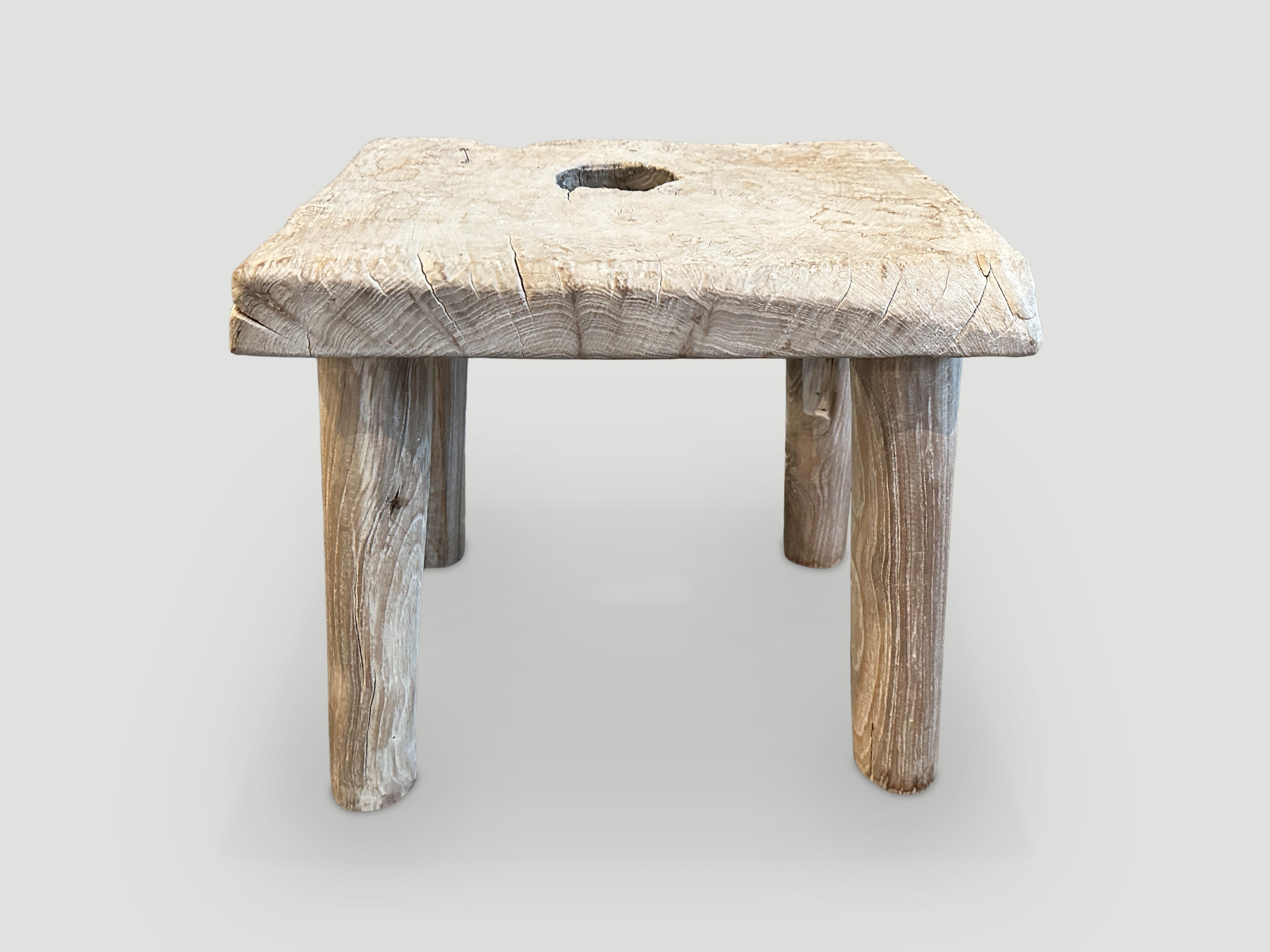 Reclaimed bleached teak stool or side table. We added minimalist cylinder legs to this organic thick slab top. 

The St. Barts Collection features an exciting new line of organic white wash, bleached and natural weathered teak furniture. The