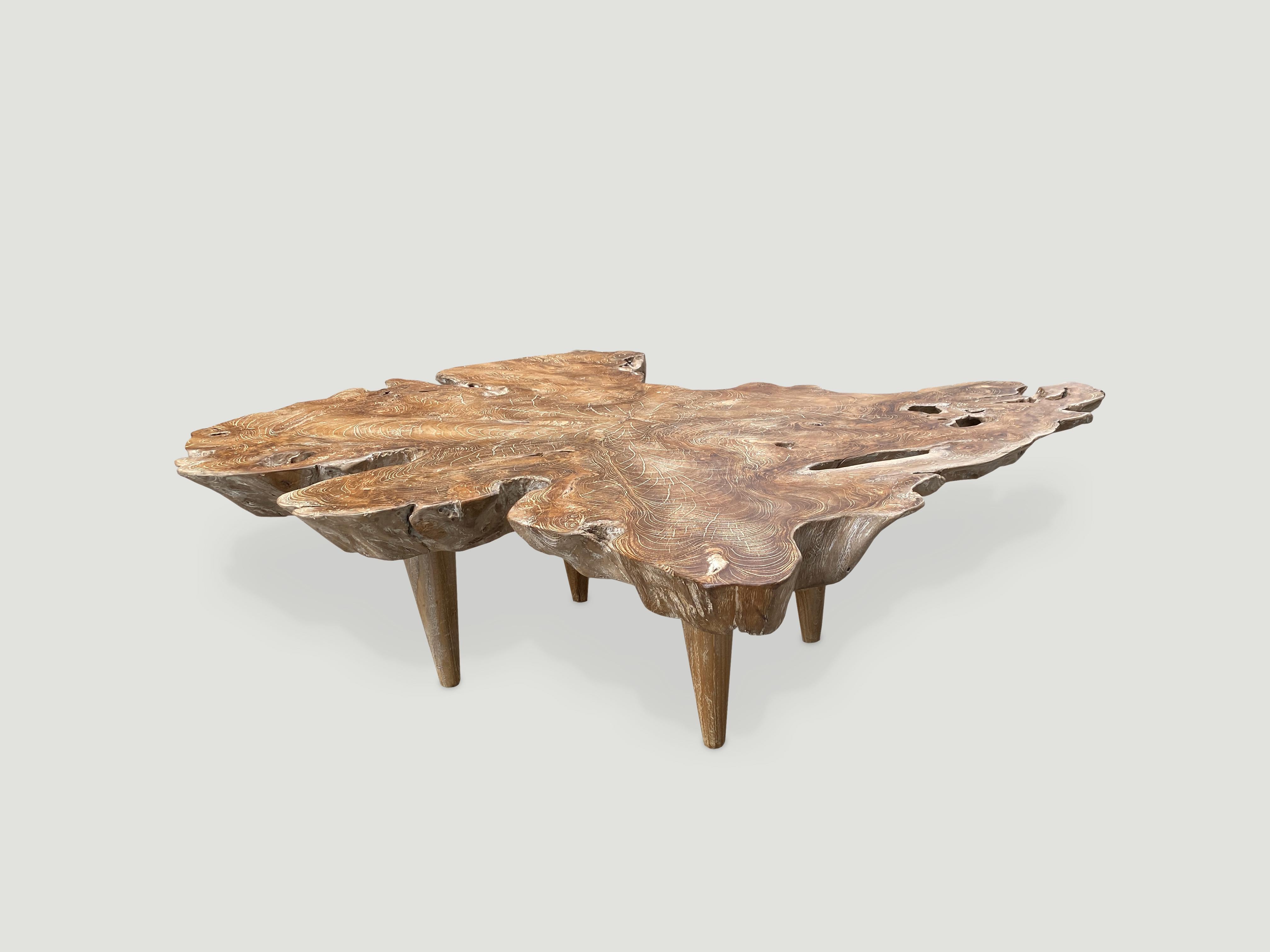Impressive reclaimed three inch thick teak wood coffee table from the root of a tree. A blend of organic and midcentury. We added a light Cerused finish. Floating on midcentury style legs.

Own an Andrianna Shamaris original.

Andrianna Shamaris.