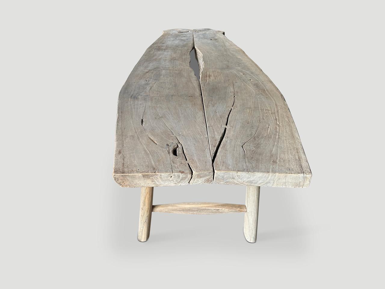 An impressive five inch slab of teak wood was sliced into two pieces and placed together to produce this one of a kind dining table. We added butterflies into the top, bleached the wood and then applied our secret ingredient revealing the beautiful