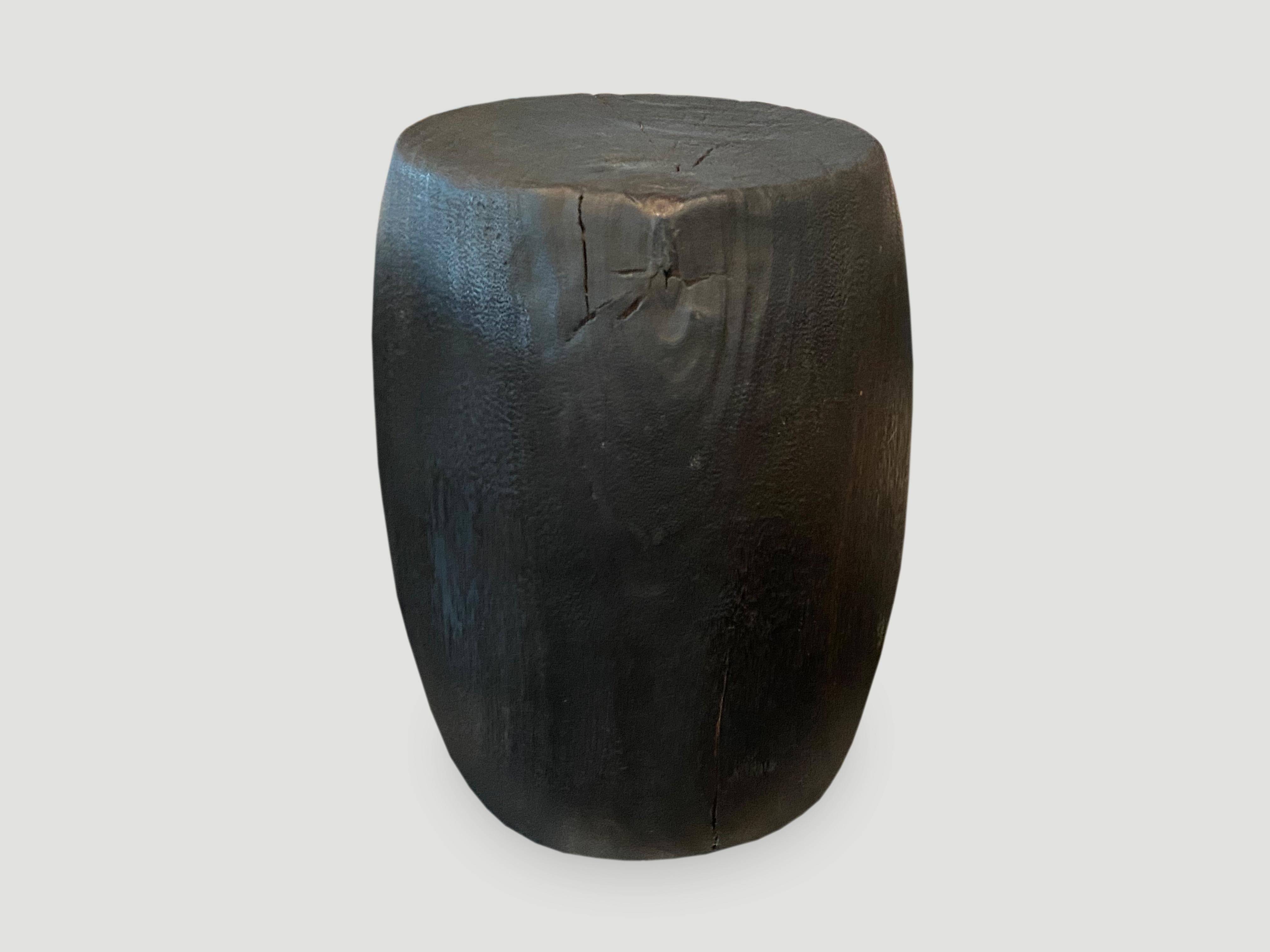Hand carved drum shape reclaimed lychee wood side table or stool. Charred, sanded and sealed revealing the beautiful wood grain. Custom stains and finishes available. Please inquire.

The Triple Burnt Collection represents a unique line of modern