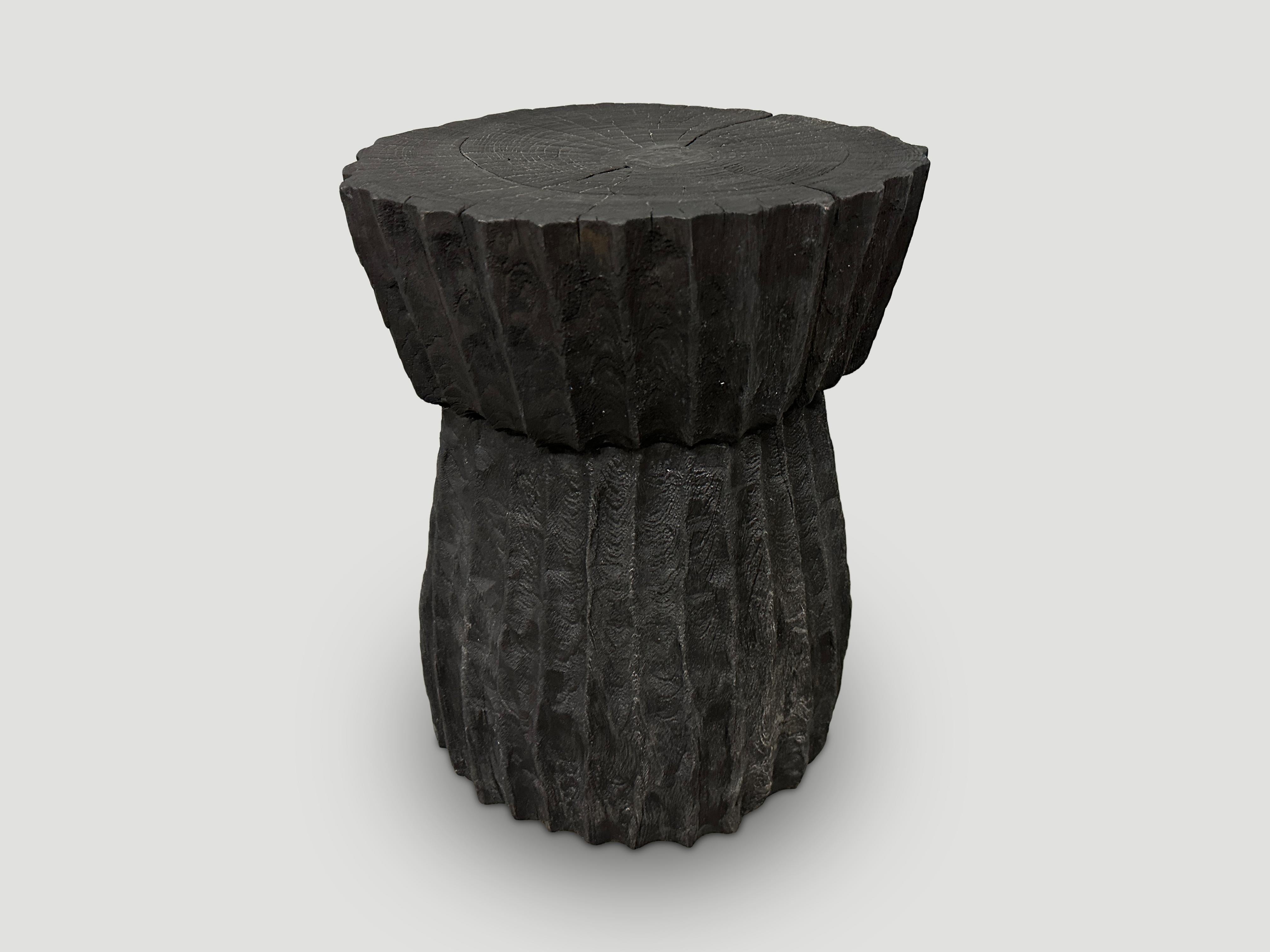 Beautiful hand carved minimalist teak wood charred side table. We have a collection in different shapes and sizes. The price reflects the one shown. Also available bleached.

The Triple Burnt Collection represents a unique line of modern furniture