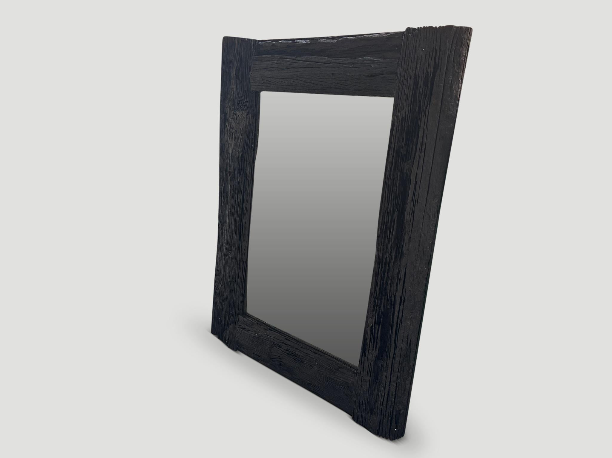 Impressive reclaimed ironwood frame mirror. Charred sanded and sealed revealing the beautiful wood grain. Custom finishes and sizes available. Please inquire. Full dimensions for the one shown;  61 x 44 x 3