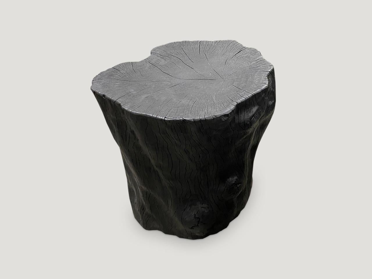 Reclaimed lychee wood side table. Burnt, sanded and sealed whilst respecting the natural organic shape and exposing the beautiful grain of the wood. We have a collection. All unique. The price and size reflect the one shown.

The Triple Burnt