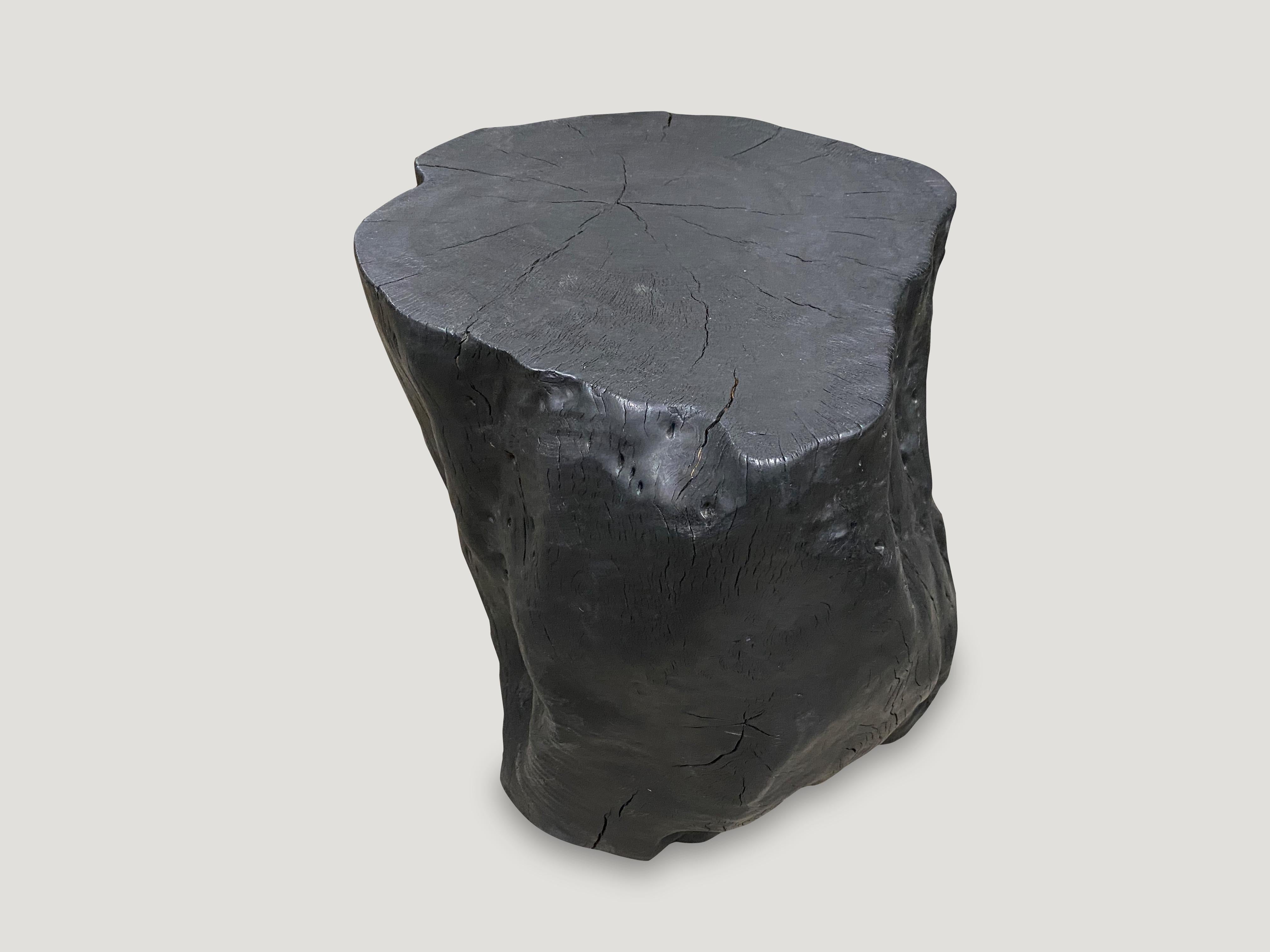 Reclaimed lychee wood side table. Burnt, sanded and sealed whilst respecting the natural organic shape and exposing the beautiful grain of the wood. We have a collection. All unique. The price and size reflect the one shown.

The Triple Burnt