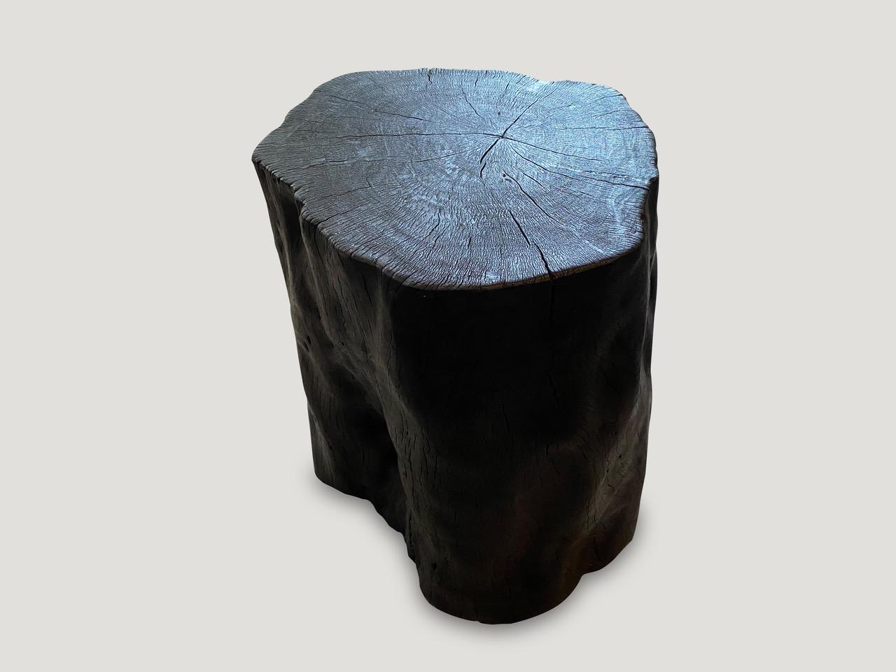 Reclaimed lychee wood side table. Burnt, sanded and sealed whilst respecting the natural organic shape and exposing the beautiful grain of the wood. We have a collection. All unique. The price and size reflect the one shown.

The Triple Burnt