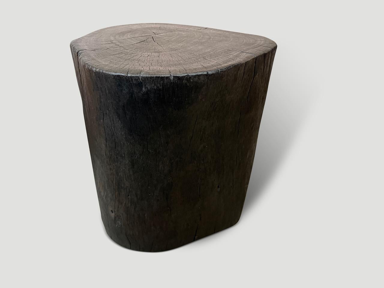 Reclaimed lychee wood side table. Charred, sanded and sealed whilst respecting the natural organic shape and revealing the beautiful wood grain.

The Triple Burnt Collection represents a unique line of modern furniture made from solid reclaimed