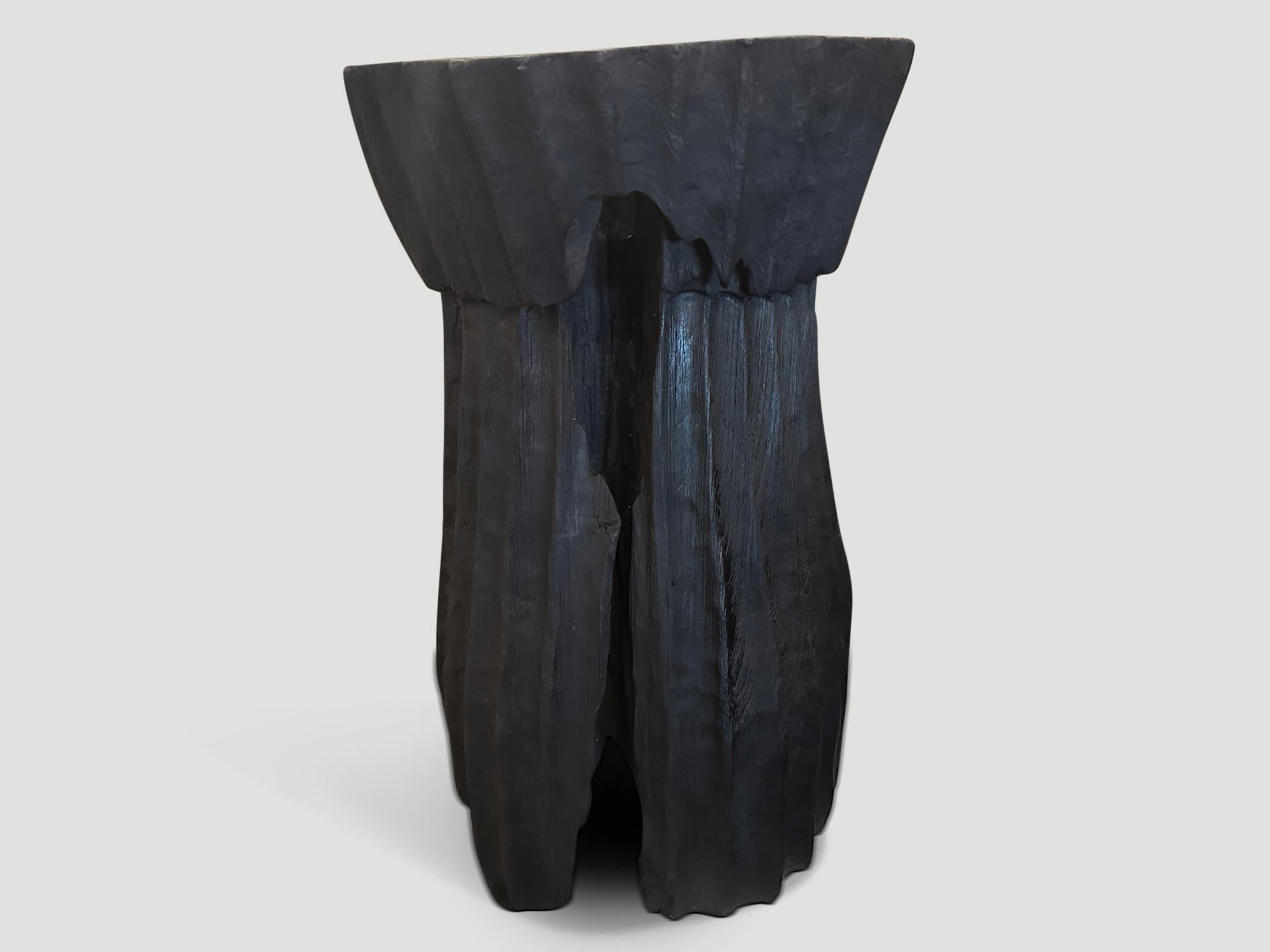 Beautiful hand carved minimalist charred teak wood side table or pedestal. We have a small collection in different shapes and sizes. The price reflects the one shown. Also available bleached.

The Triple Burnt Collection represents a unique line of