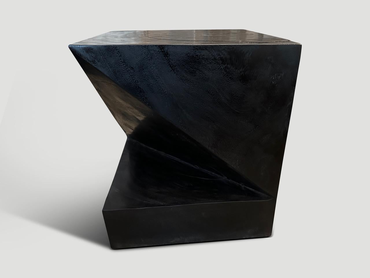 Solid reclaimed suar wood side table. Inspired by the art of paper folding which is often associated with Japanese culture. Pair available. The price reflects the one shown.

The Triple Burnt Collection represents a unique line of modern furniture