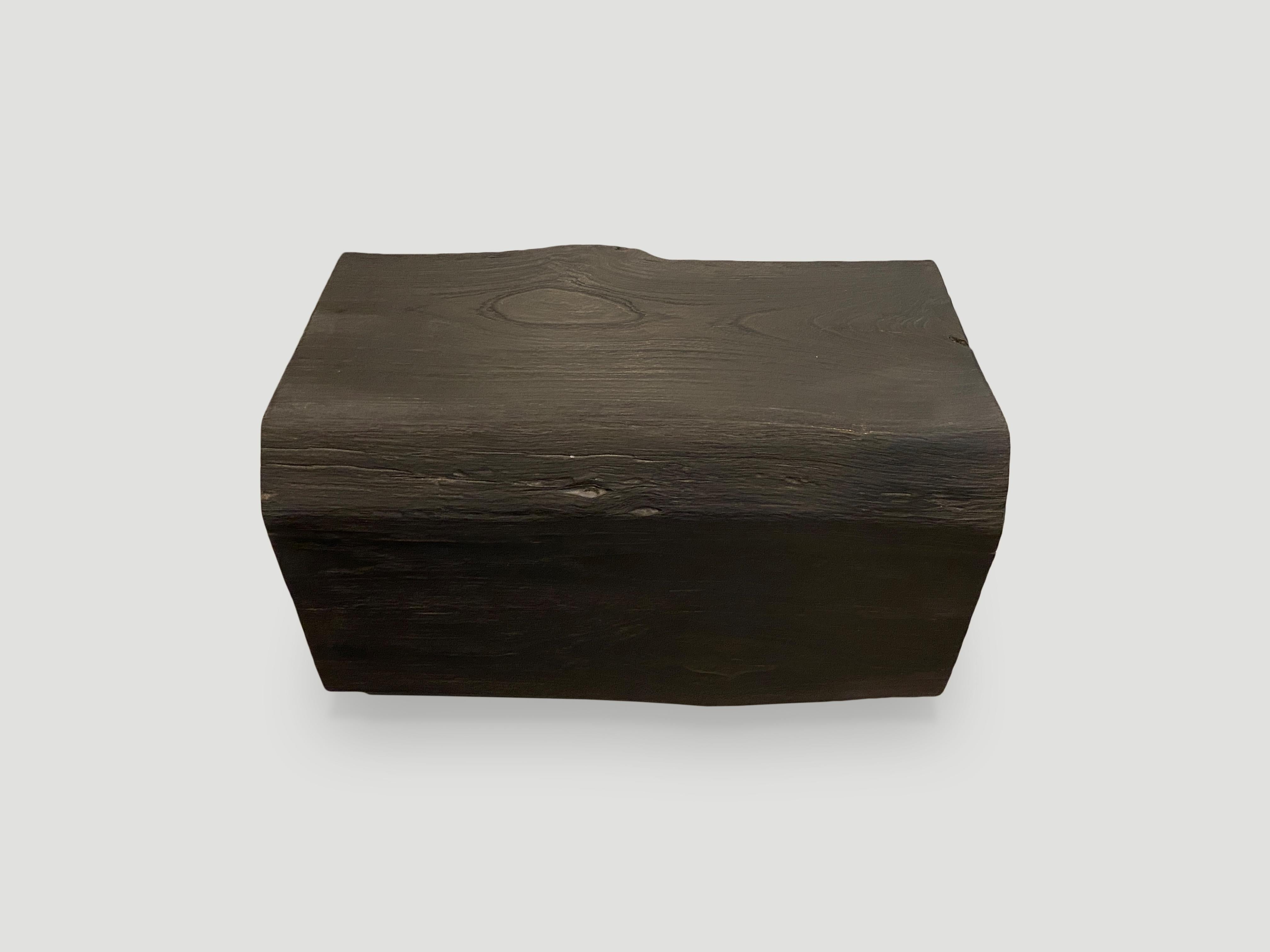 Reclaimed solid teak log bench or coffee table. Charred, sanded and sealed revealing the beautiful wood grain.

The Triple Burnt Collection represents a unique line of modern furniture made from solid organic wood. Burnt three times to produce a