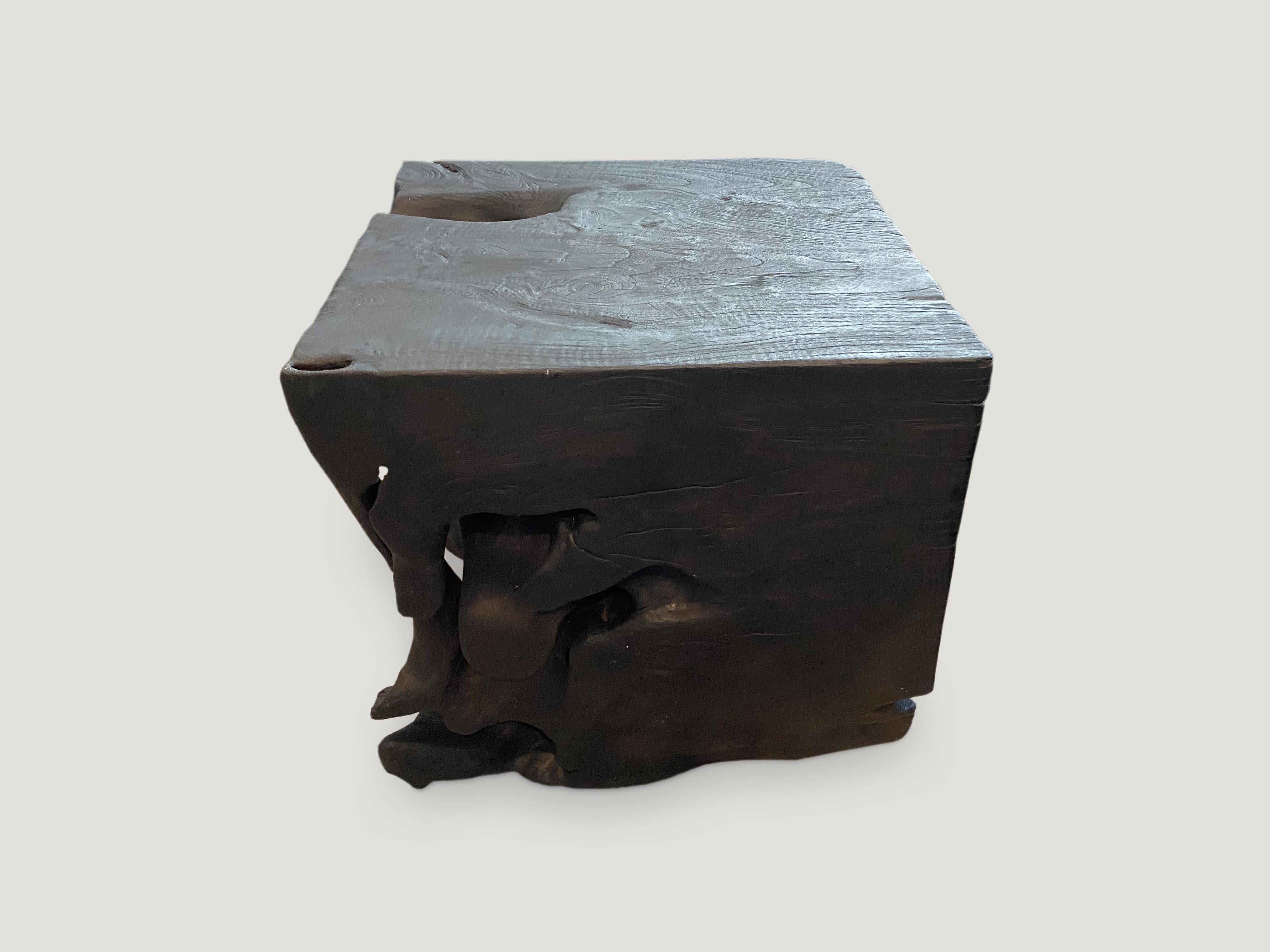 Sculptural organic reclaimed teak side table or stool. Burnt, sanded and sealed with a smooth finish exposing the beautiful grain of the wood. Organic is the new modern.

The Triple Burnt collection represents a unique line of modern furniture