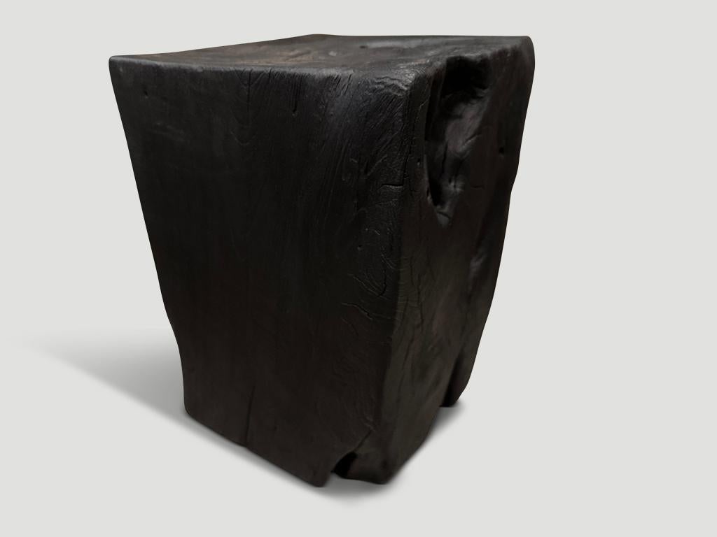 Reclaimed teak wood side table hand carved whilst respecting the natural organic wood. Charred, sanded and sealed revealing the beautiful wood grain. We have a collection. The images reflect the one shown. Also available bleached.

The Triple