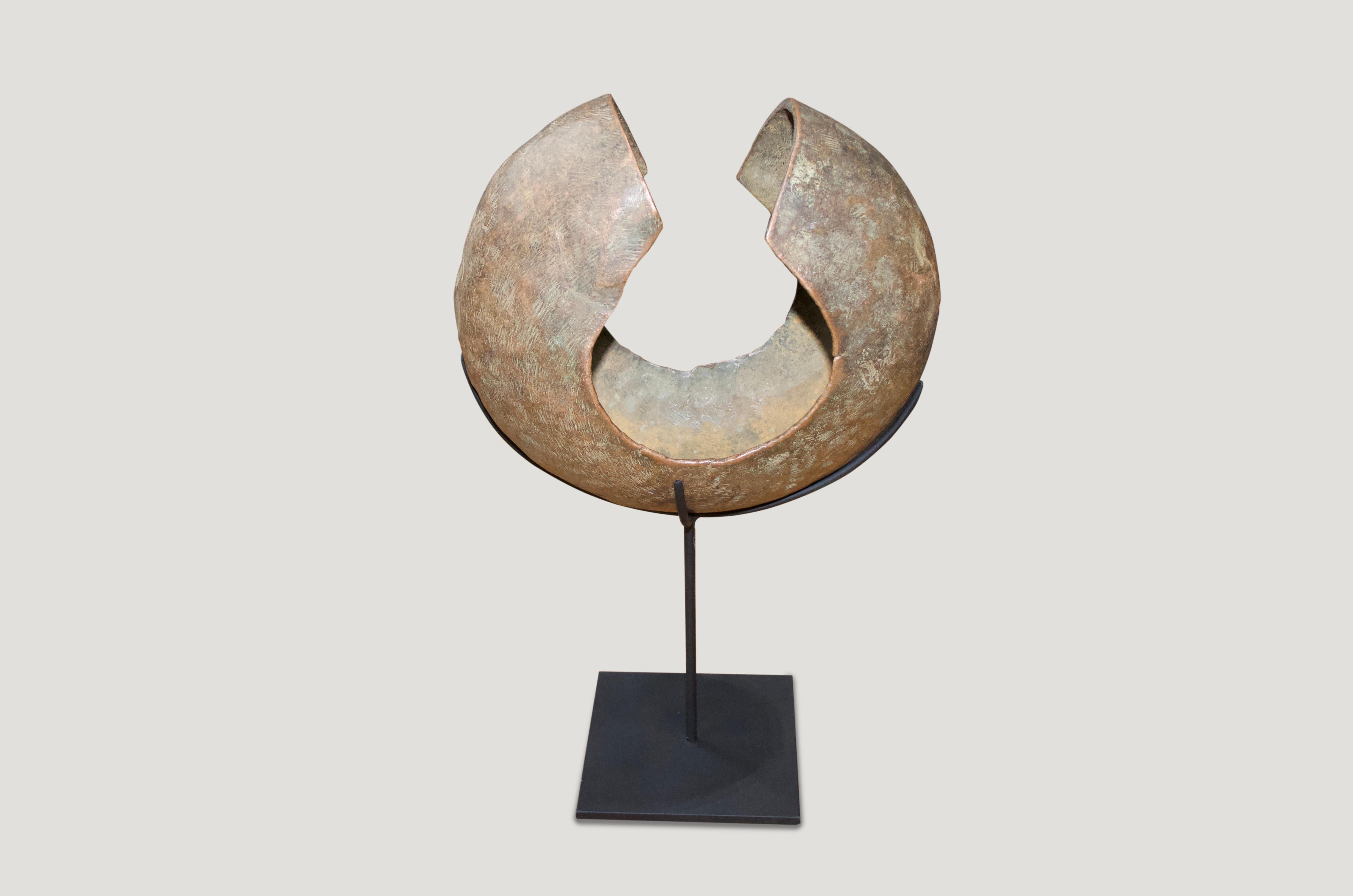 Organic Modern Andrianna Shamaris Copper African Currency on a Modern Stand