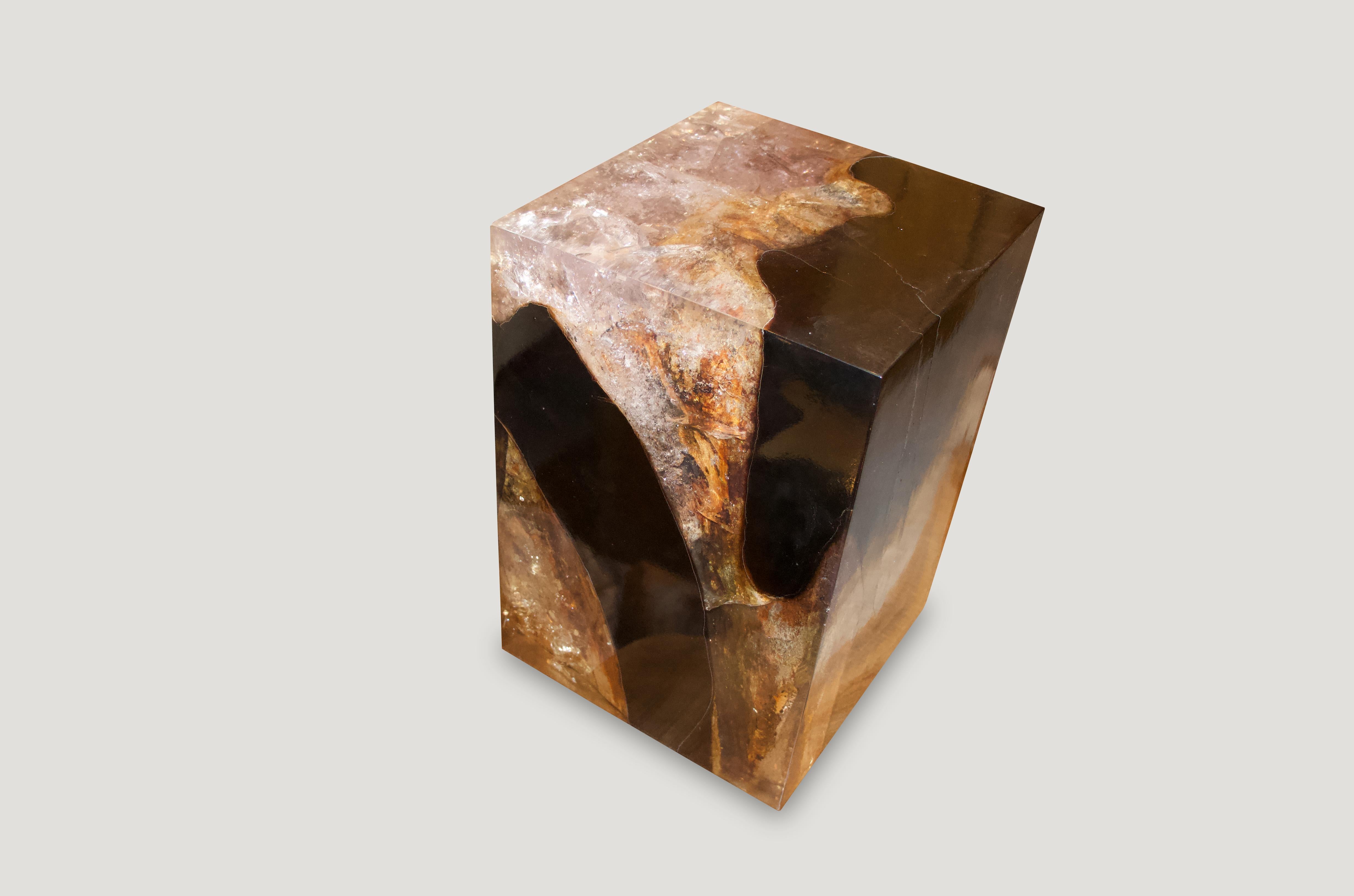 The cracked resin side table is made from teak infused with resin. A dramatic piece due to the depth of the resin, which resembles a unique quartz crystal with many different facets. An impressive addition to any space.

The Cracked Resin