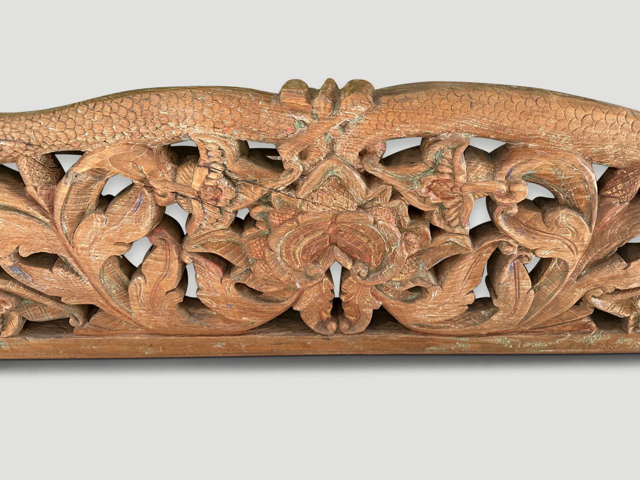 Hand carved wall hanging made from natural teak wood from Sumatra.The dragon symbolizes power, change and spirituality. It also symbolizes good luck, fortune, and prosperity. In some cultures the dragon is a protector and is often associated with