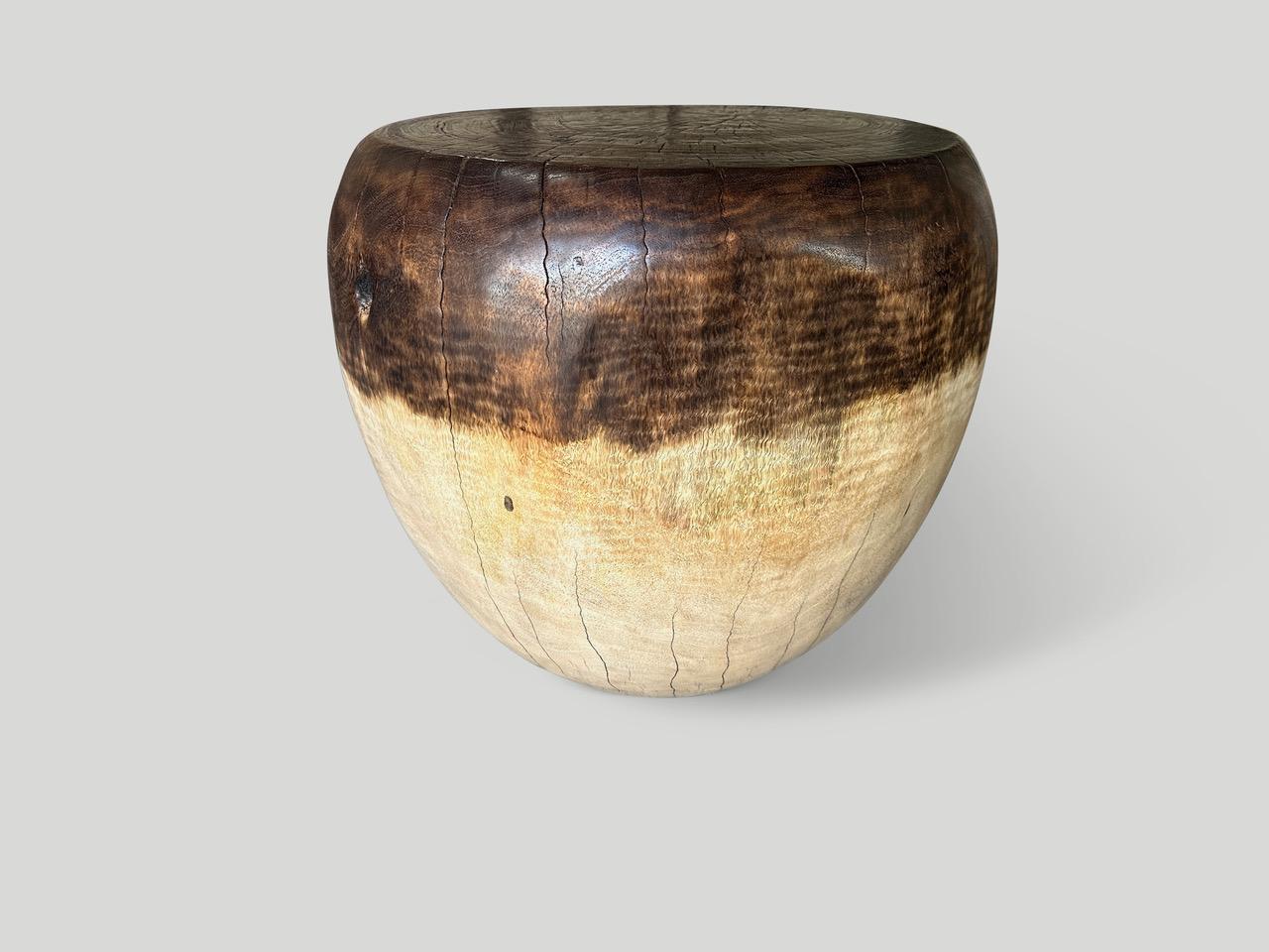 Reclaimed mango wood side table hand carved into an impressive drum shape. We partially stained the top half a chocolate brown and added a natural oil revealing the beautiful wood grain. It’s all in the details. Full dimensions; Top 16