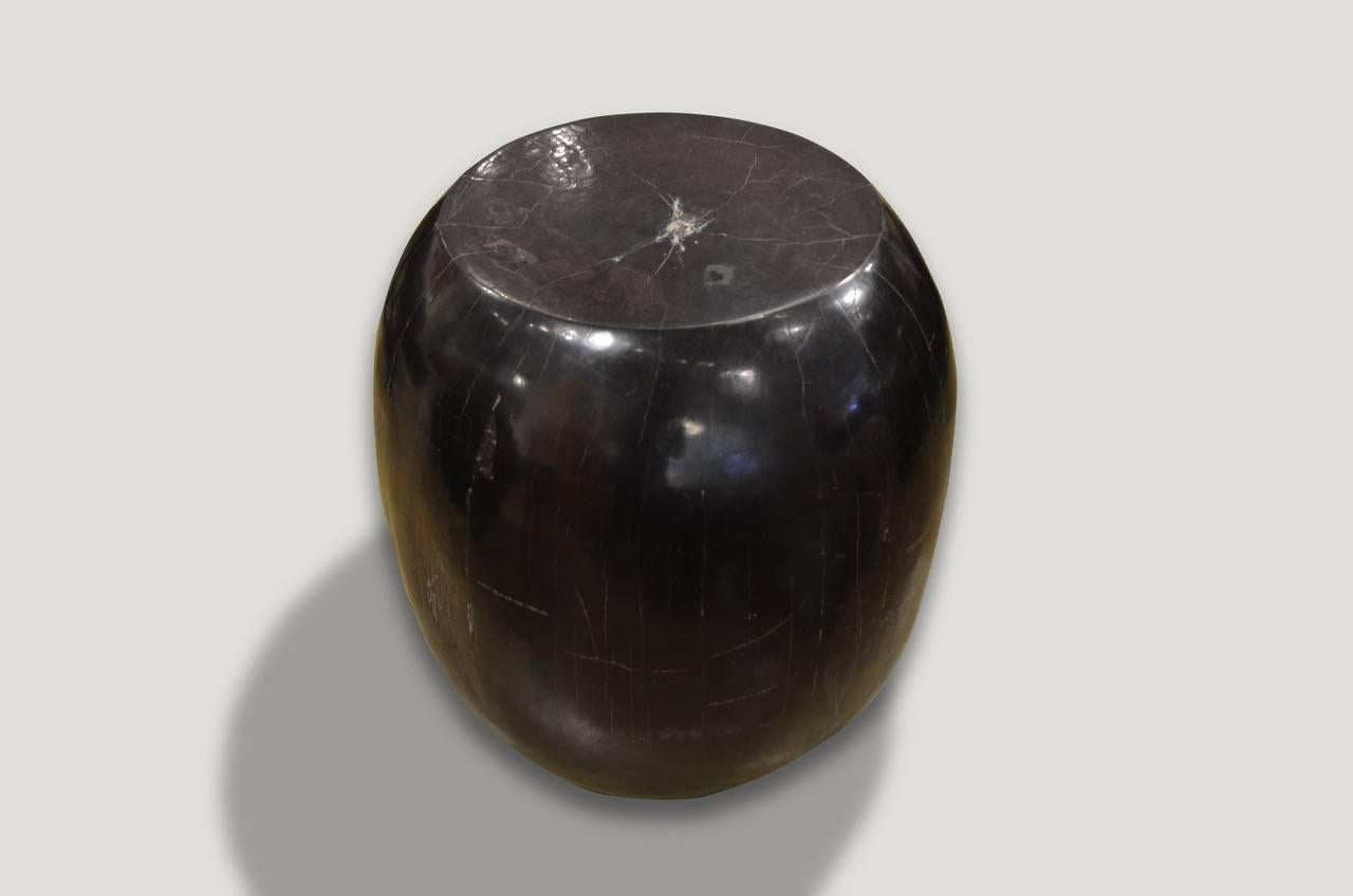 Super smooth, high quality petrified wood side table, carved into a drum shape.

We source the highest quality petrified wood available. Each piece is hand selected and highly polished with minimal cracks. Petrified wood is extremely versatile –