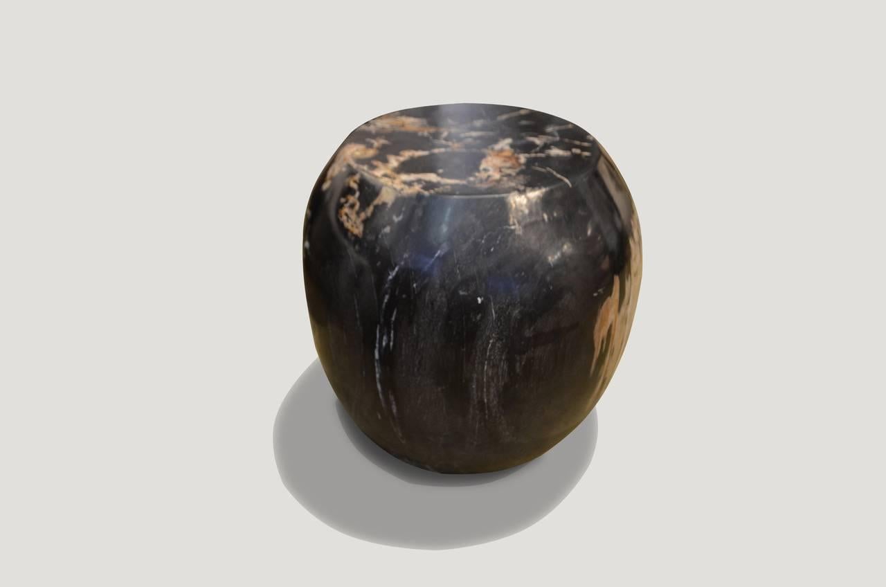 Super smooth carved petrified wood drum shape side table.

We source the highest quality petrified wood available. Each piece is hand selected and highly polished with minimal cracks. Petrified wood is extremely versatile – even great inside a